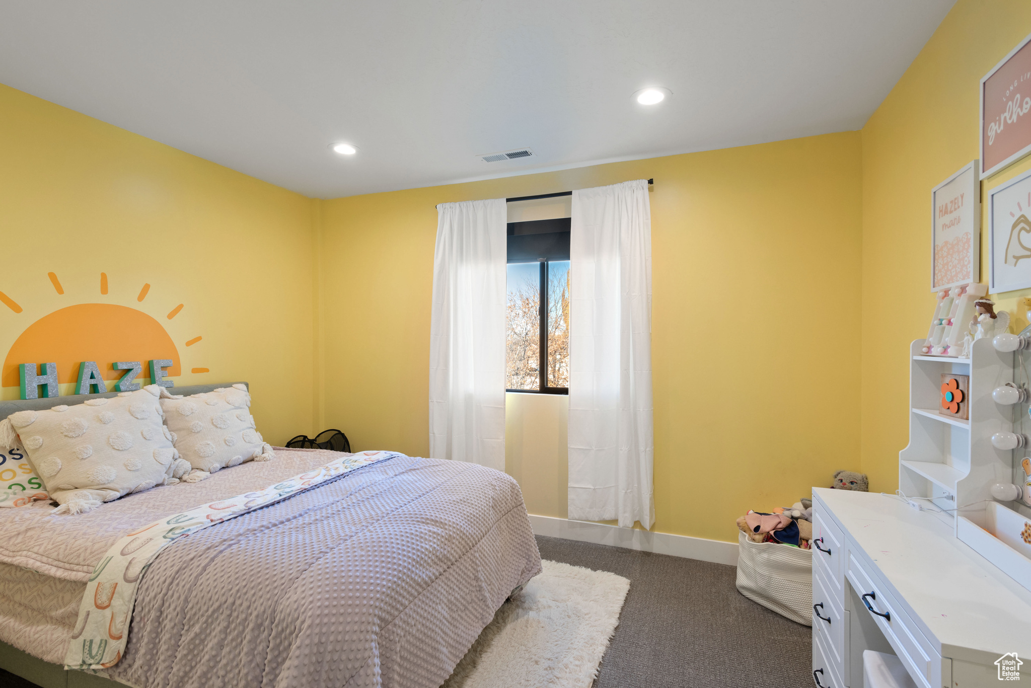 Bedroom with dark colored carpet