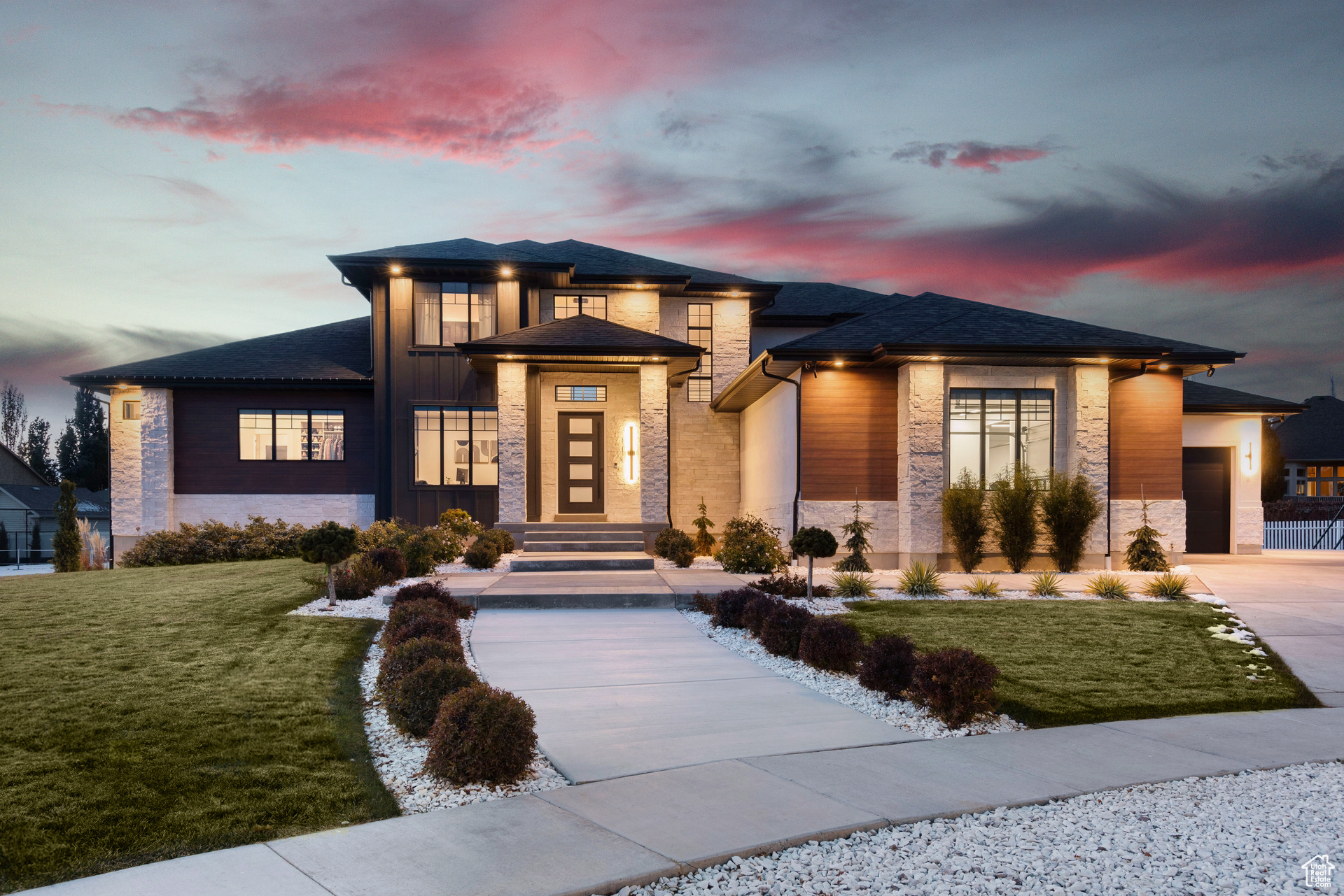 Prairie-style house with a yard and a garage