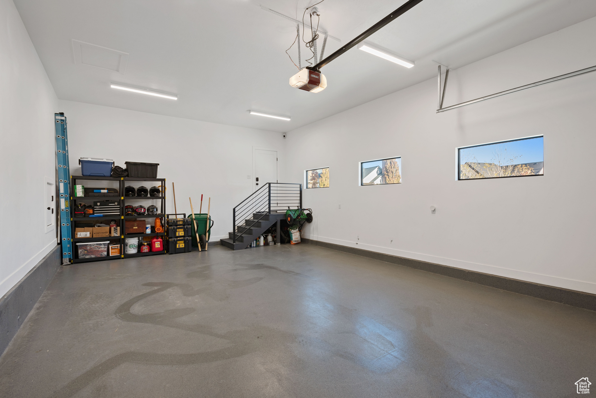 Garage featuring a garage door opener