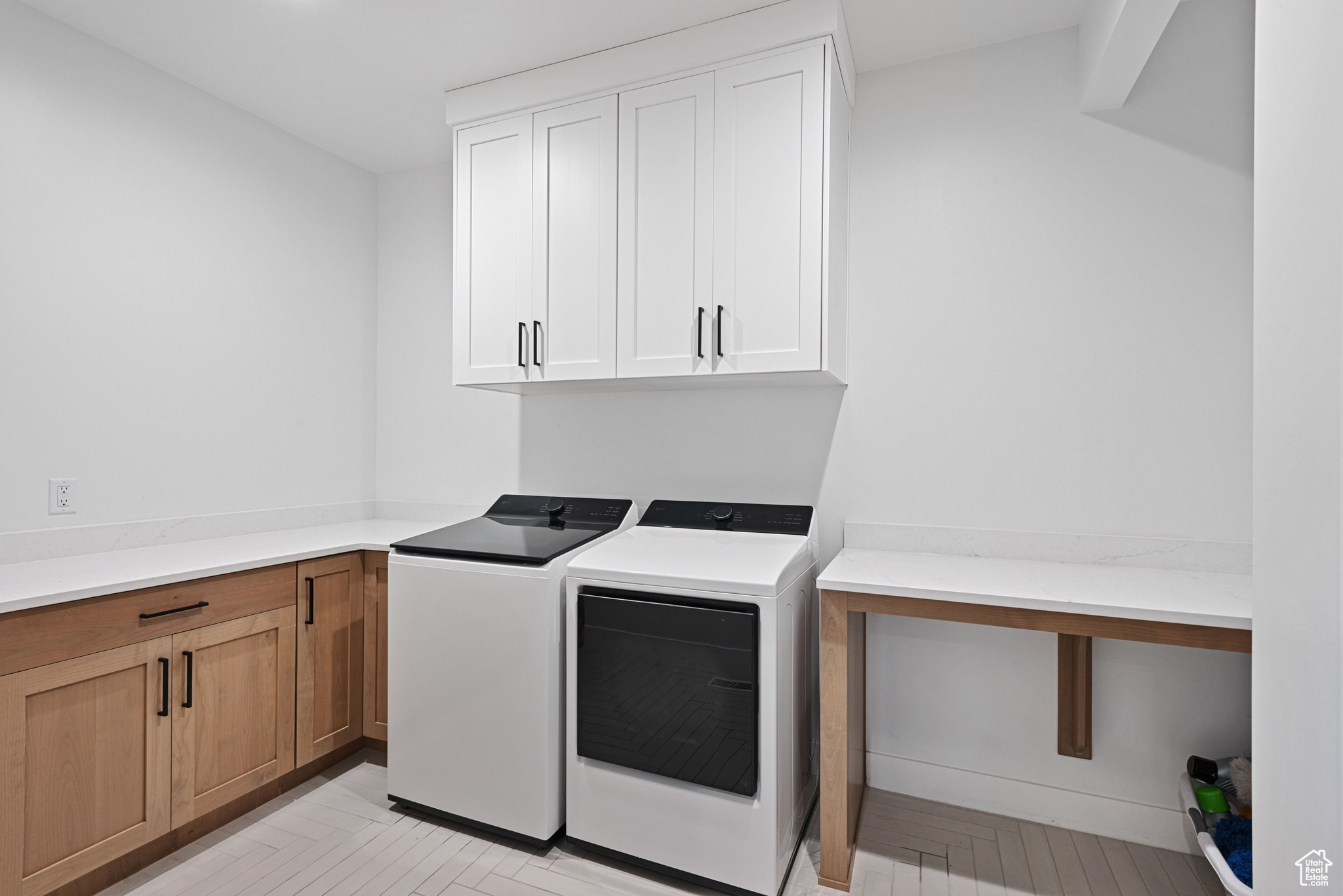 Laundry room with cabinets and washing machine and clothes dryer