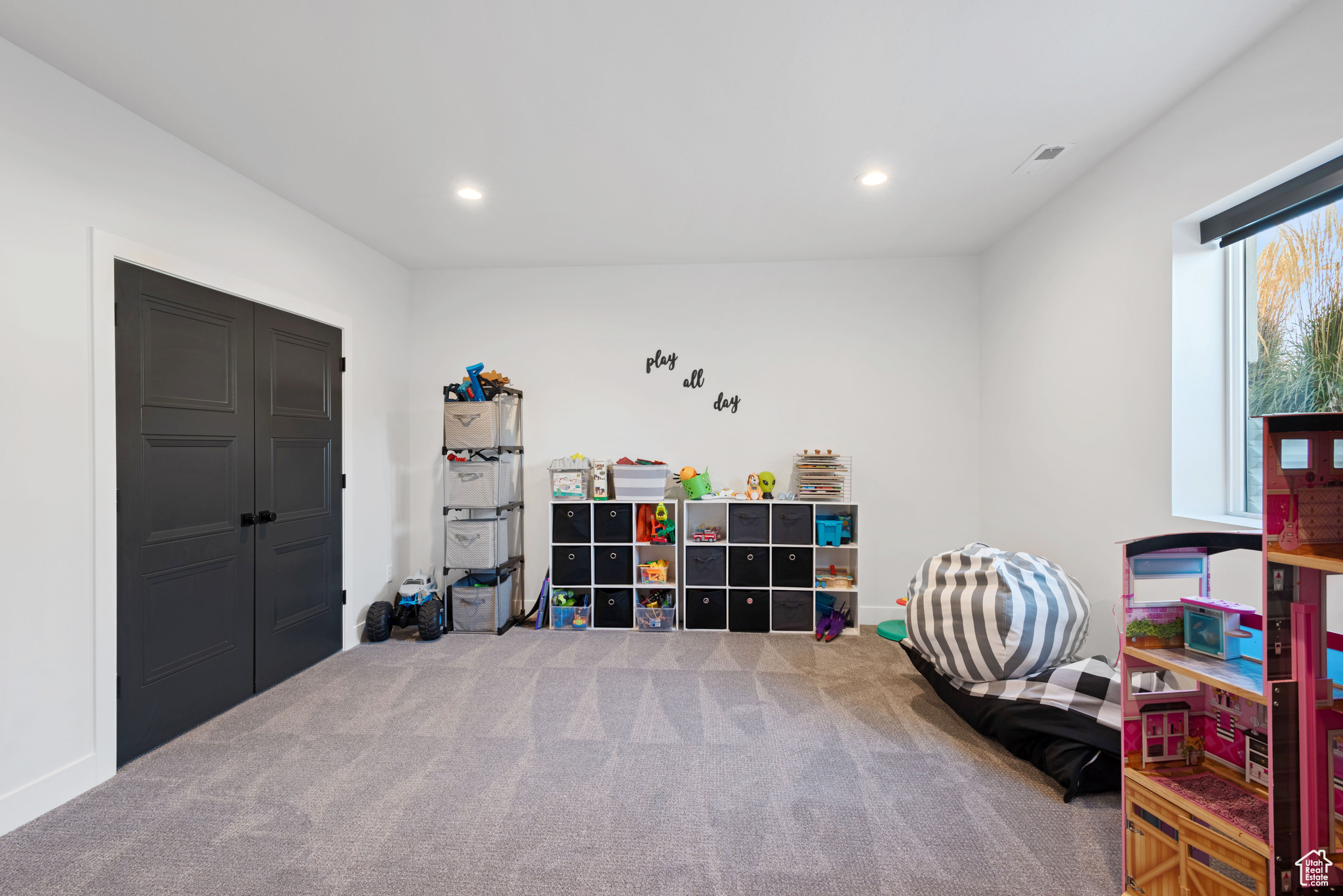 Playroom with carpet flooring