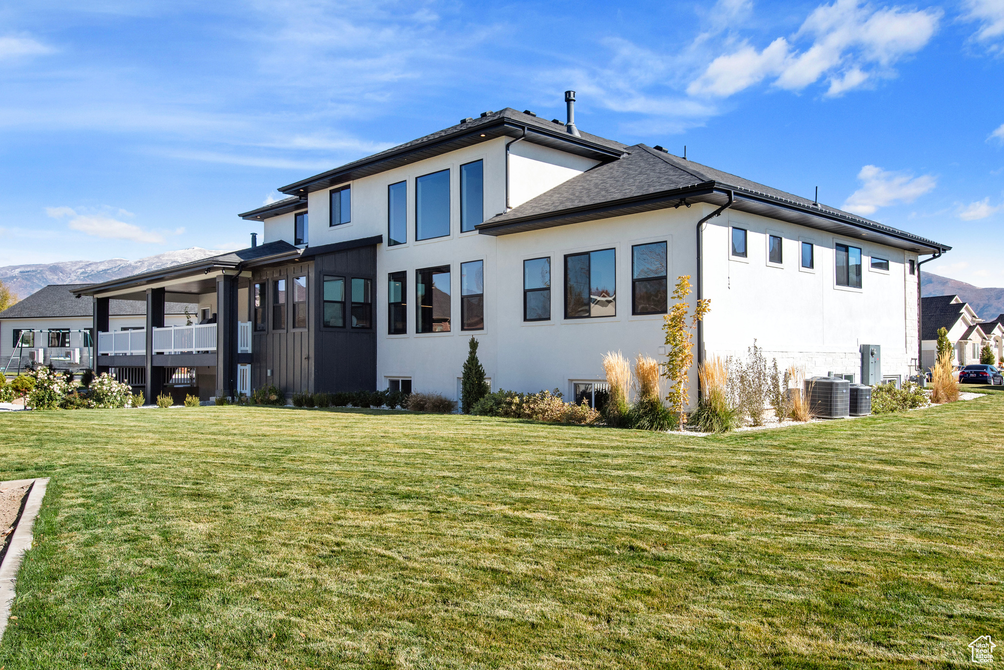 View of home's exterior featuring a lawn and cooling unit