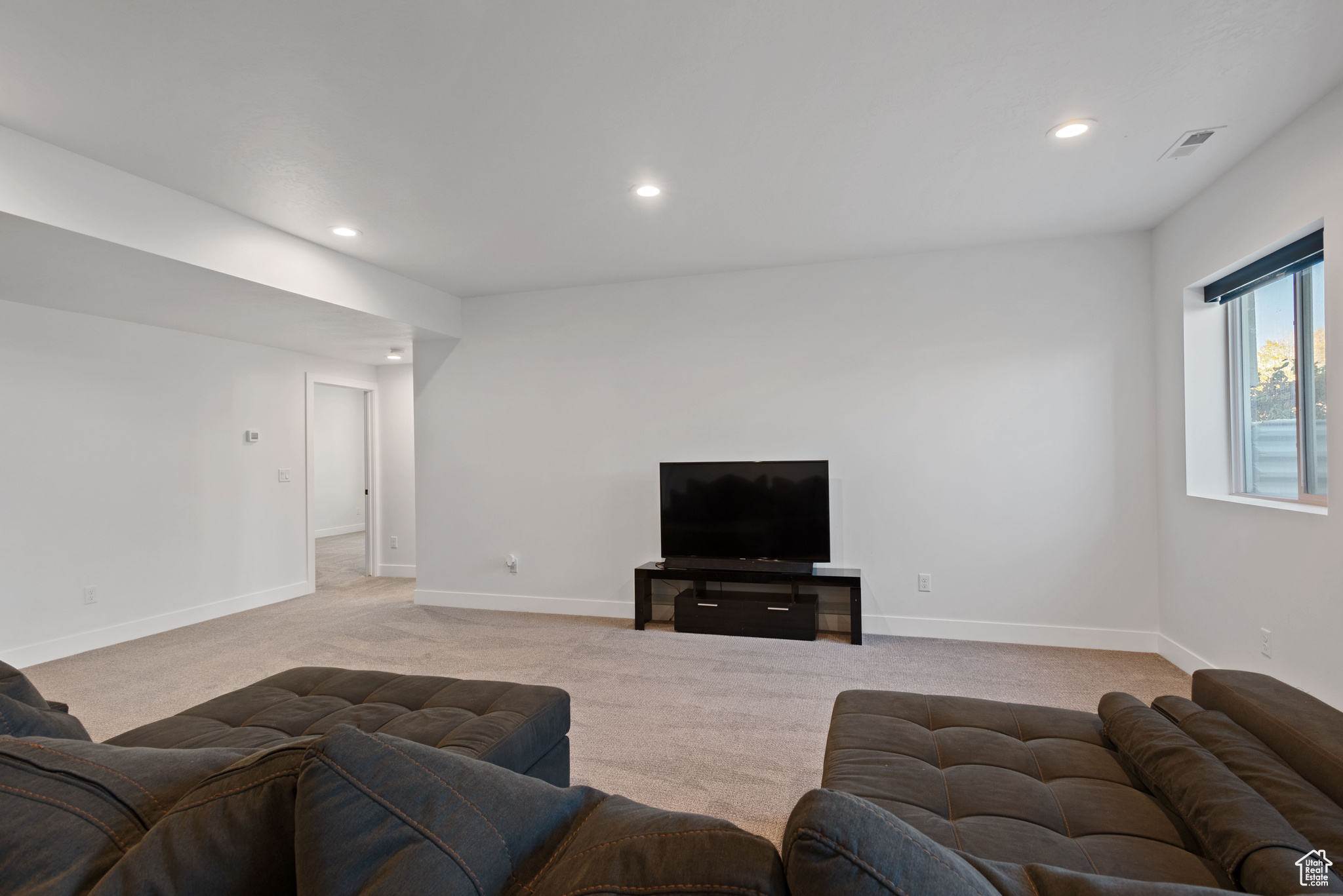 Living room with light colored carpet