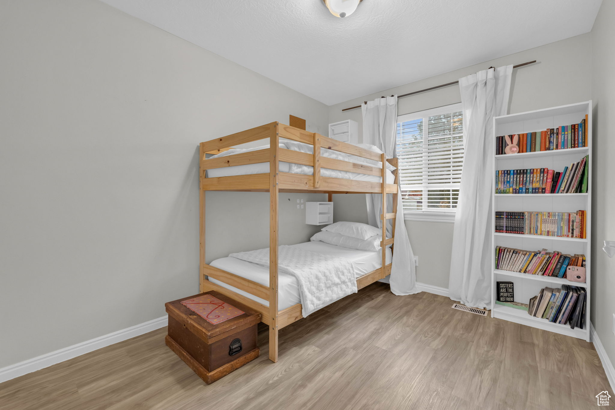 Bedroom with wood-type flooring