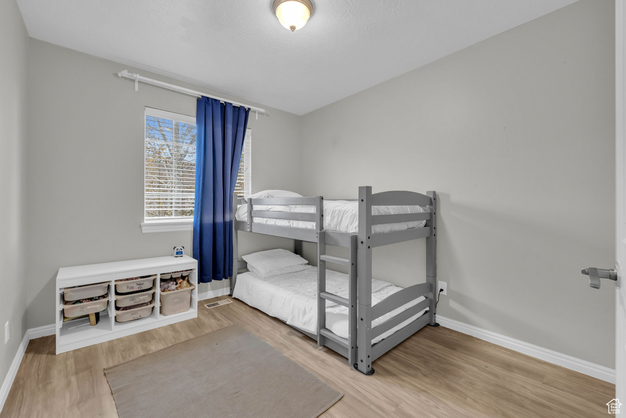 Bedroom featuring wood-type flooring