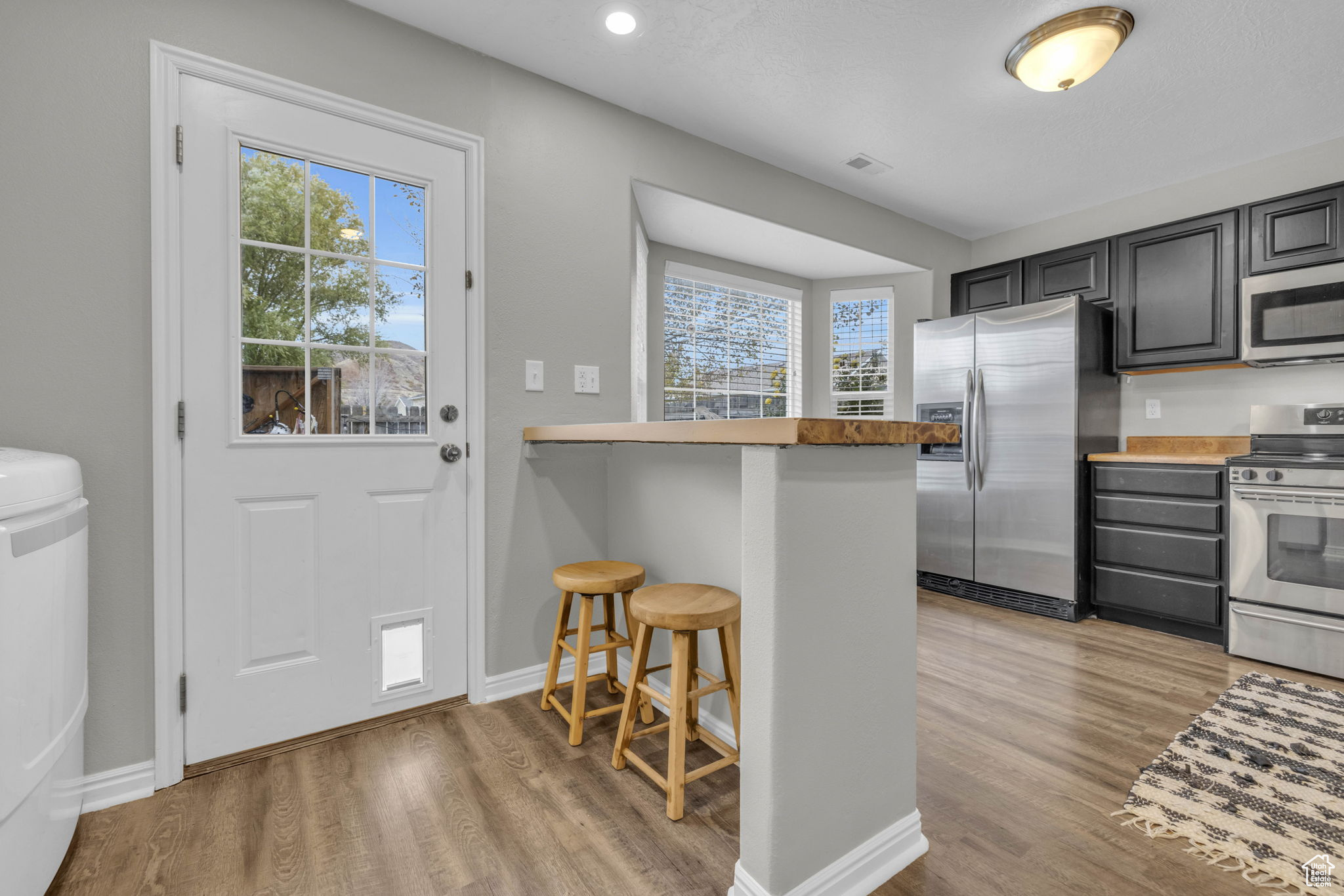 View of kitchen and rear entry