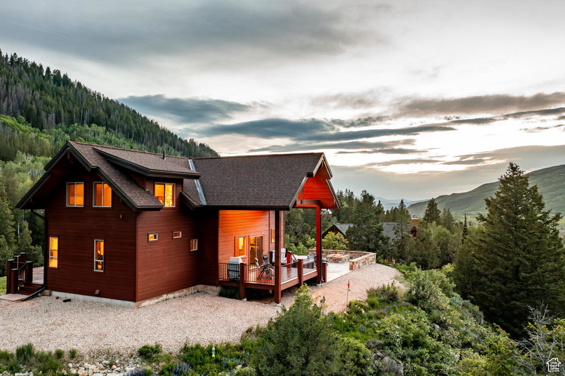 Back of property featuring a deck with mountain view