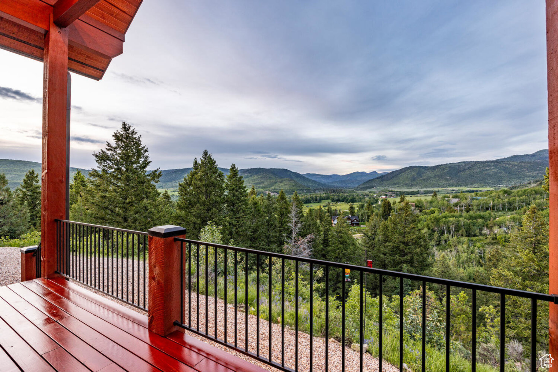 Wooden terrace featuring a mountain view