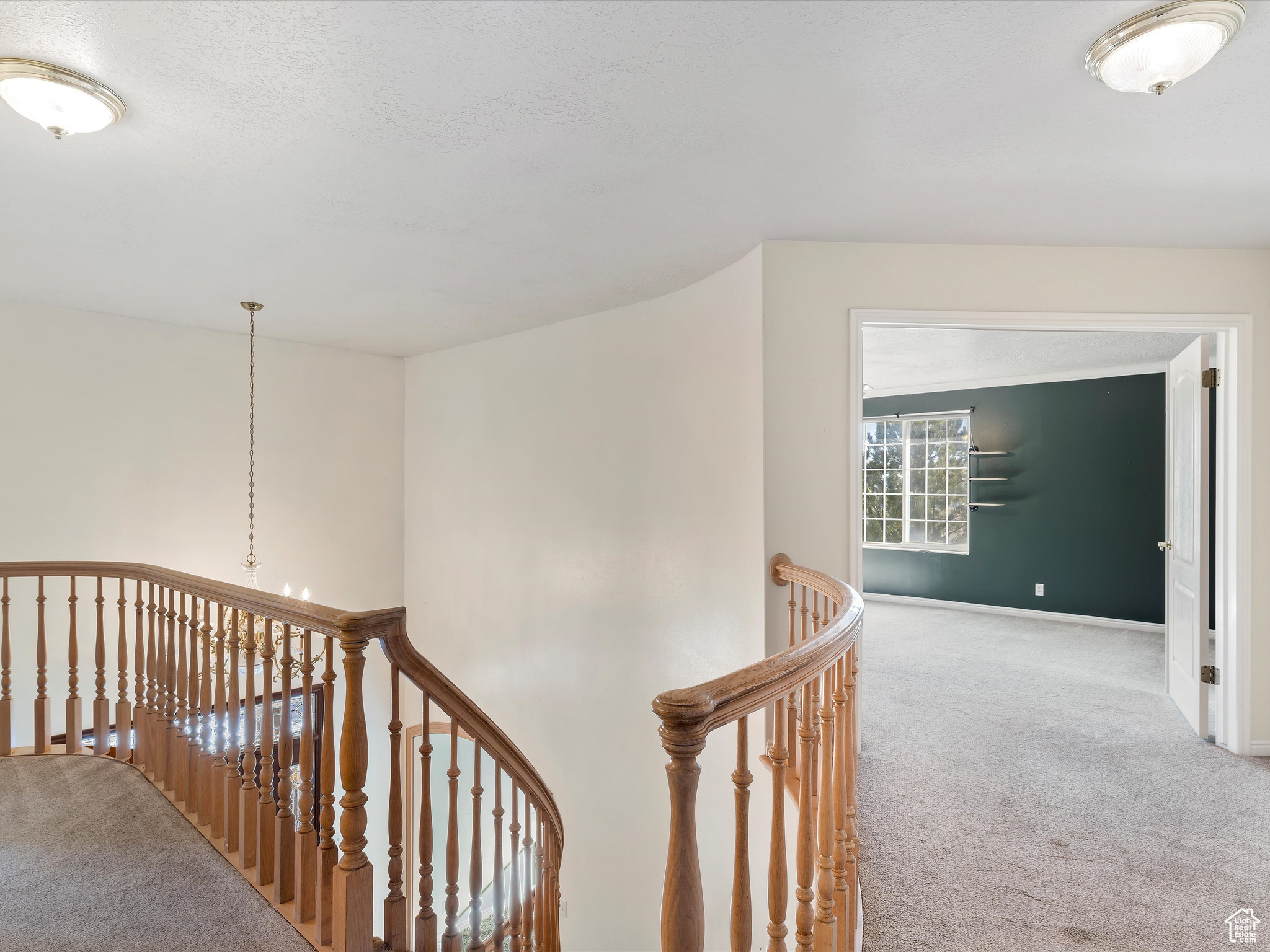 Corridor with carpet flooring