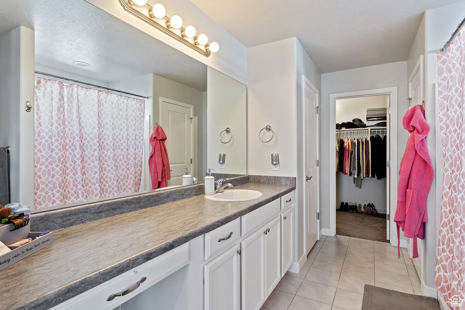 Bathroom featuring tile patterned floors and vanity