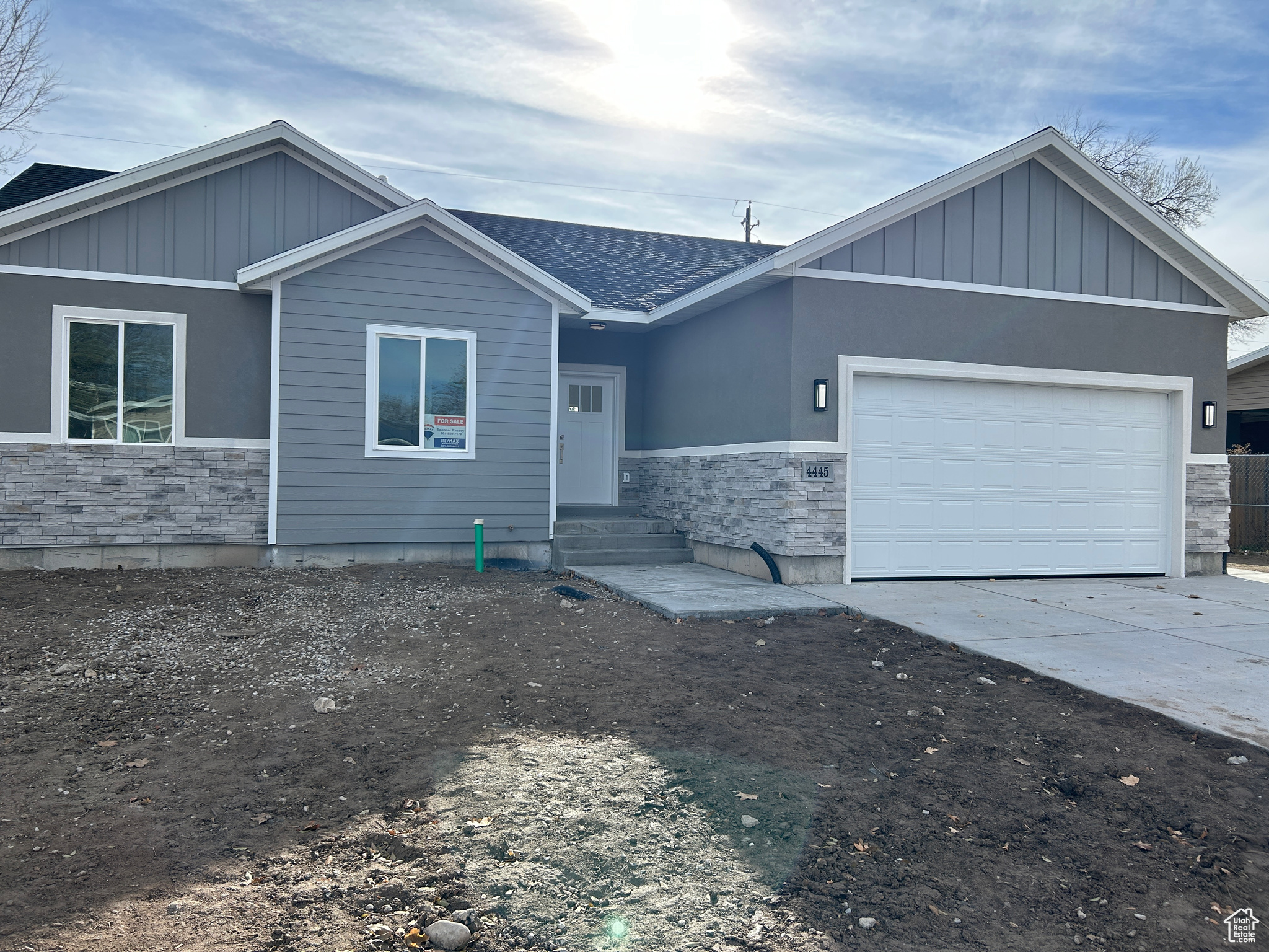 View of front of property featuring a garage