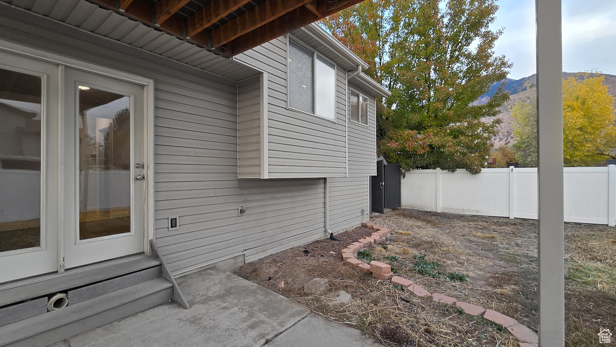 View of side of property with a mountain view