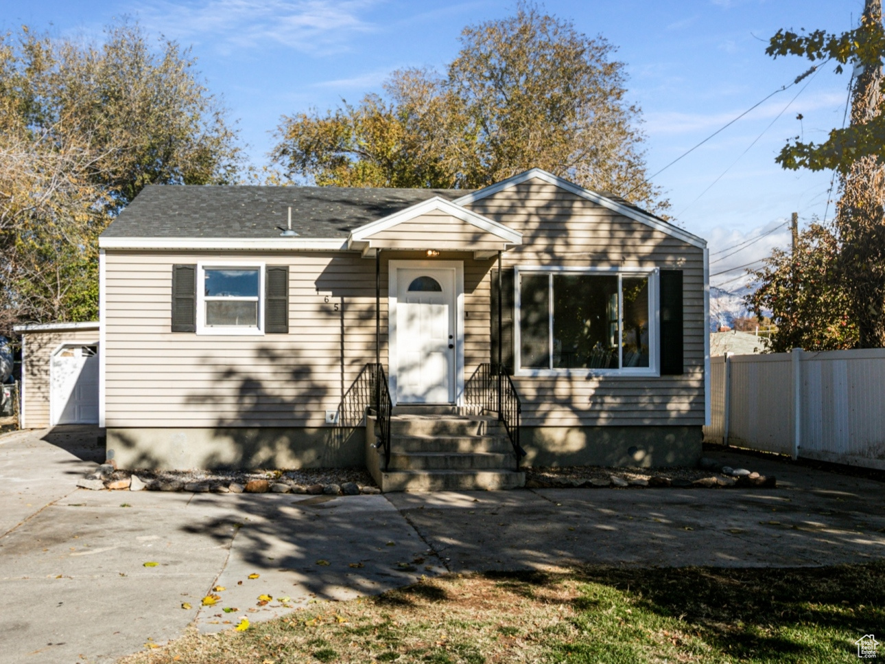 Bungalow-style house featuring a garage