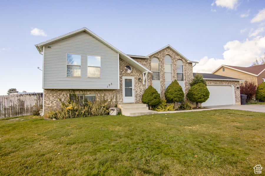 View of front of corner lot home featuring a 2 car garage and RV parking