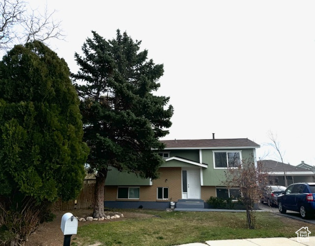 View of front of house with a front lawn