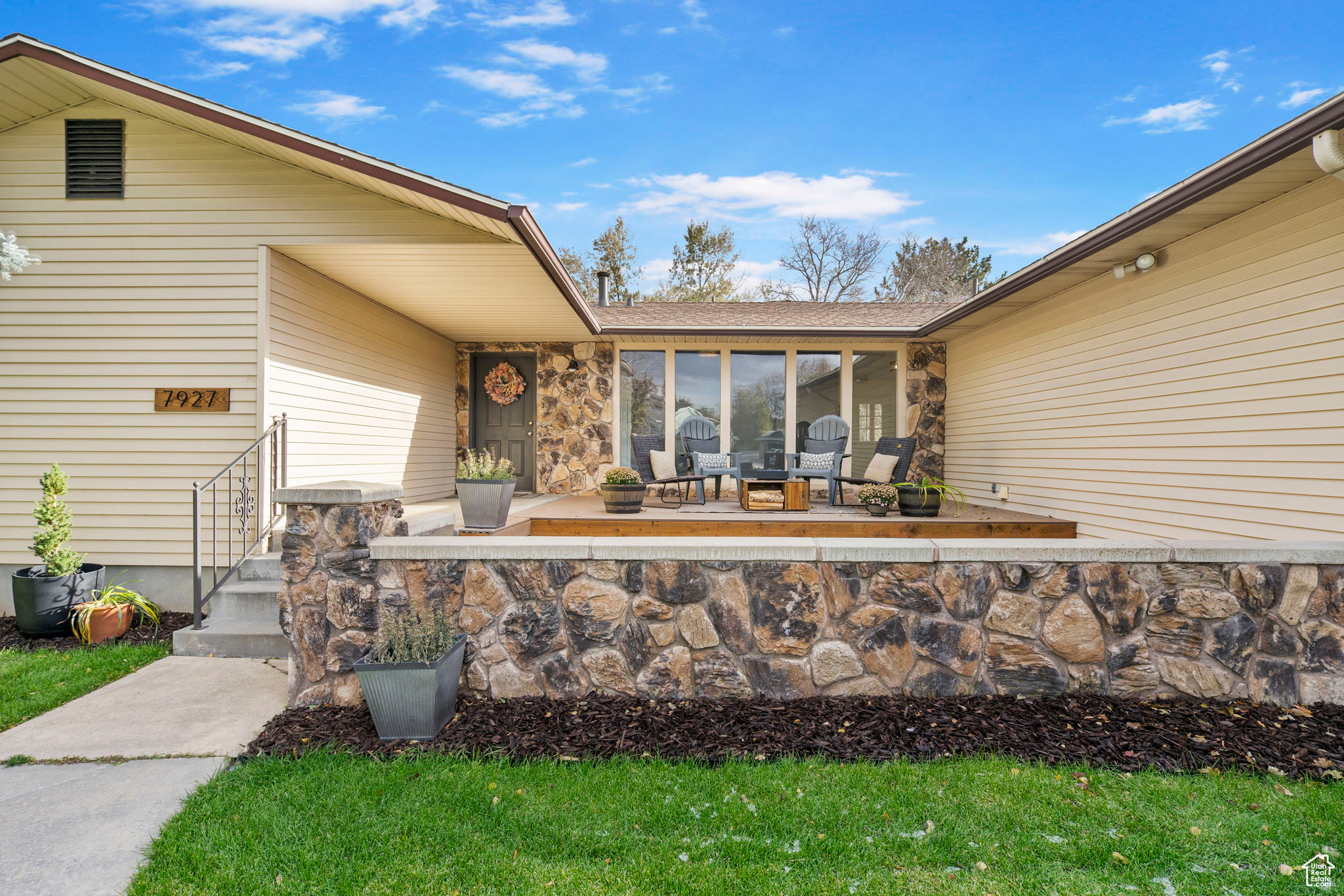 View of exterior entry with new trex deck patio area