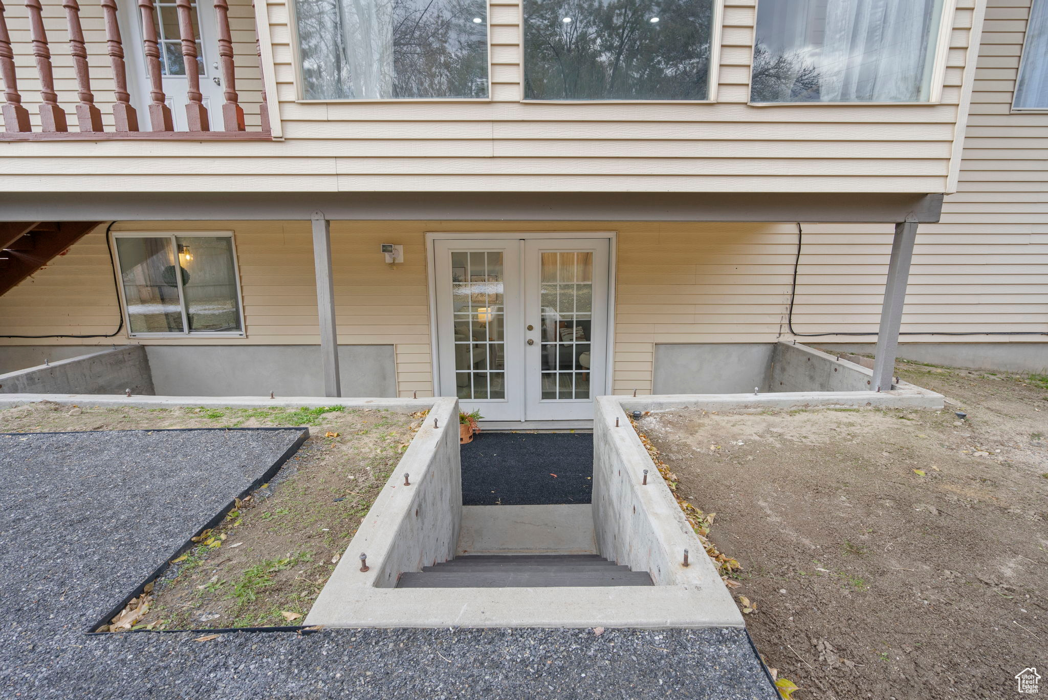 Property entrance to the back featuring french doors