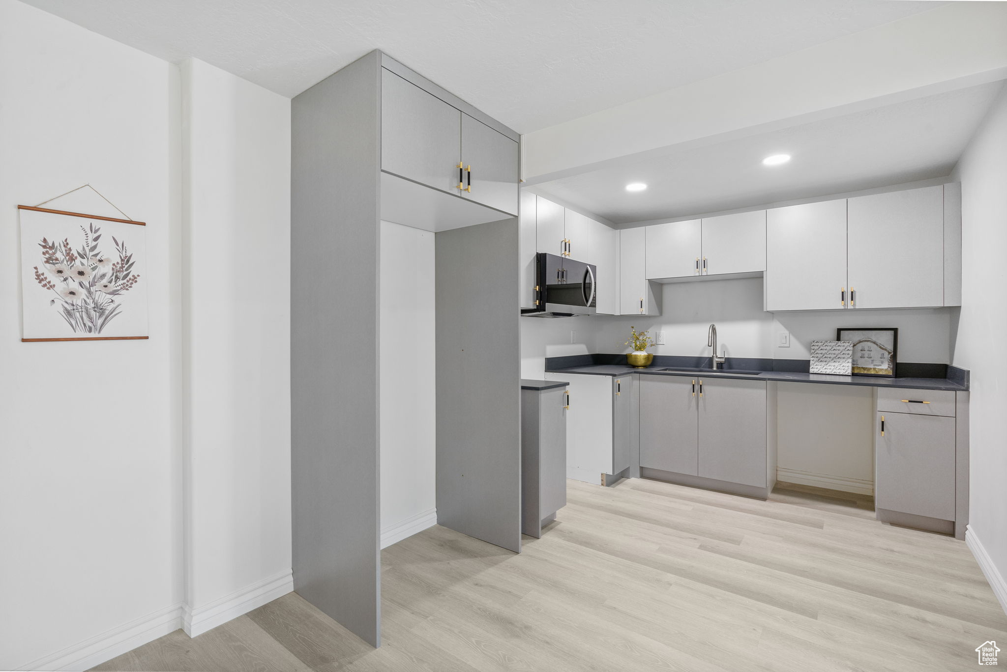 Basement kitchen with LVP flooring, charcoal quartz countertops *appliances on order