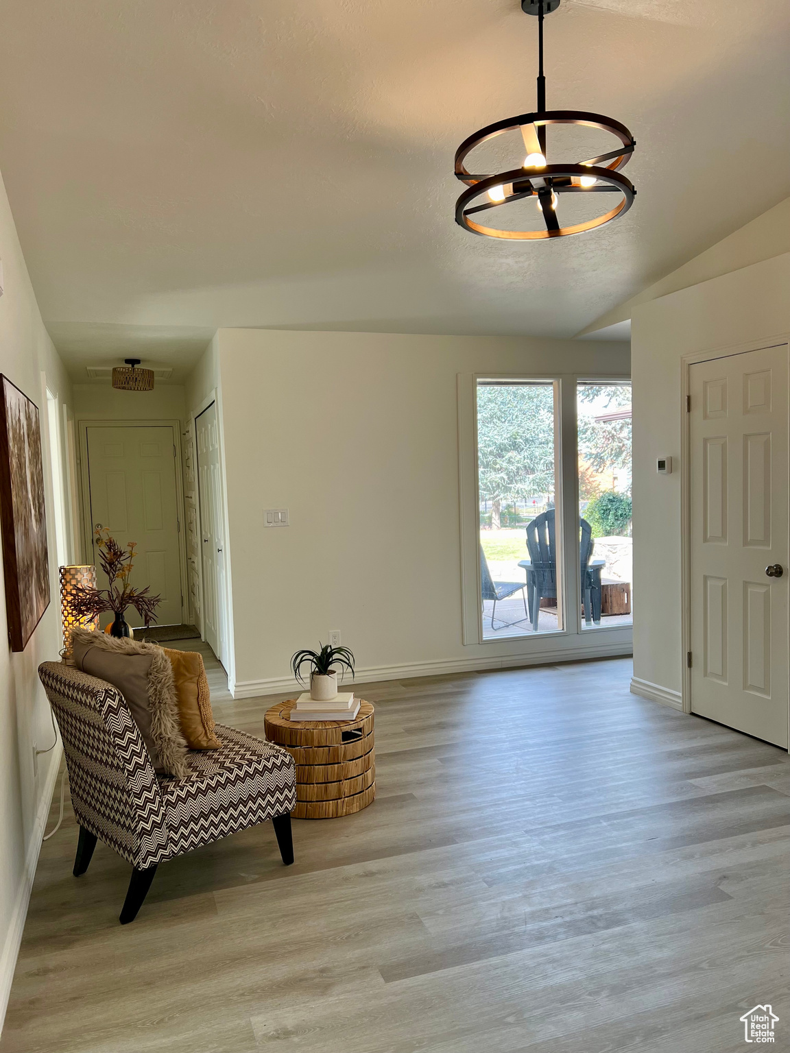 Interior space with light hardwood / wood-style flooring and lofted ceiling