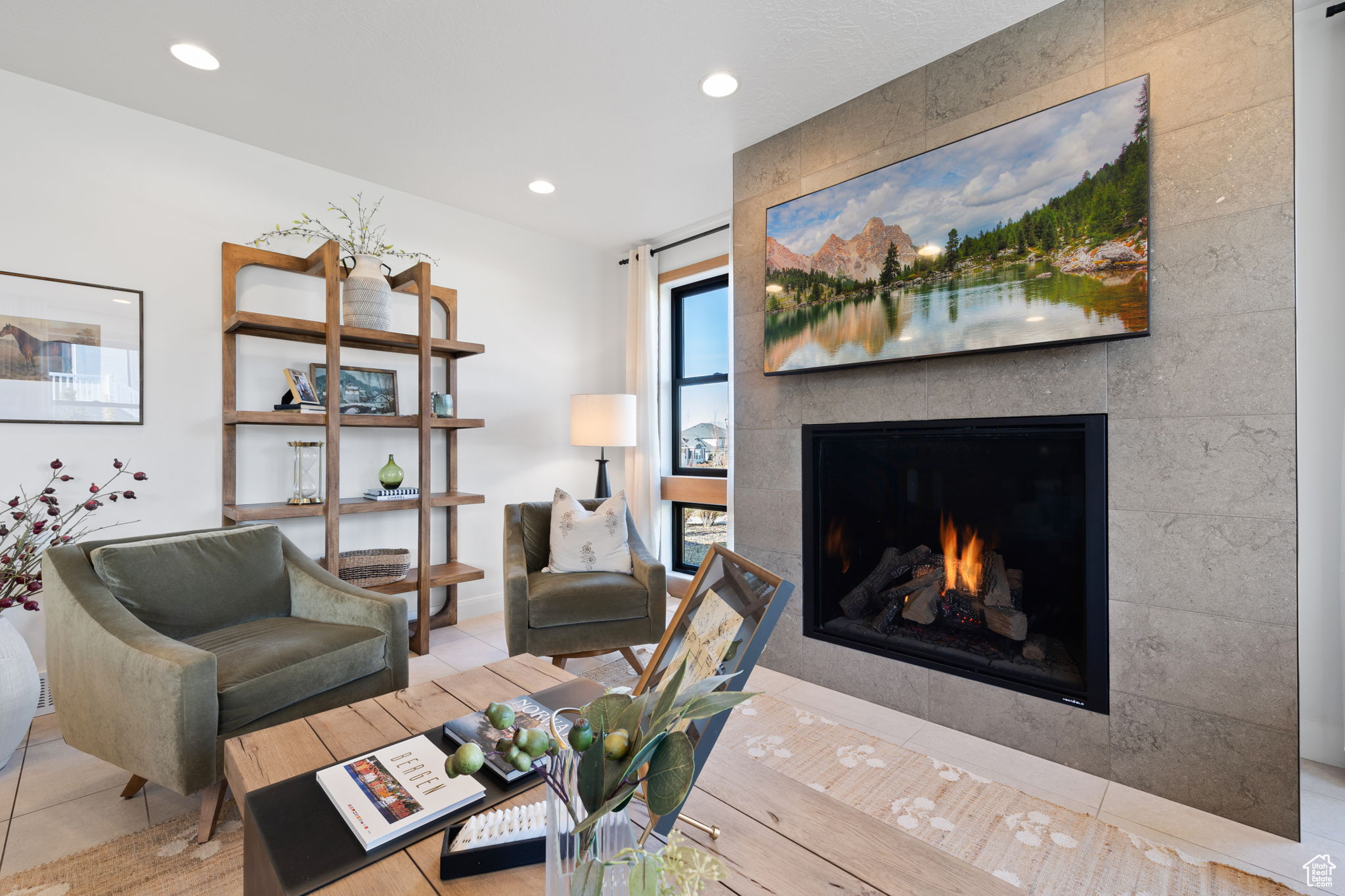 Living room with a tile fireplace and tile patterned flooring