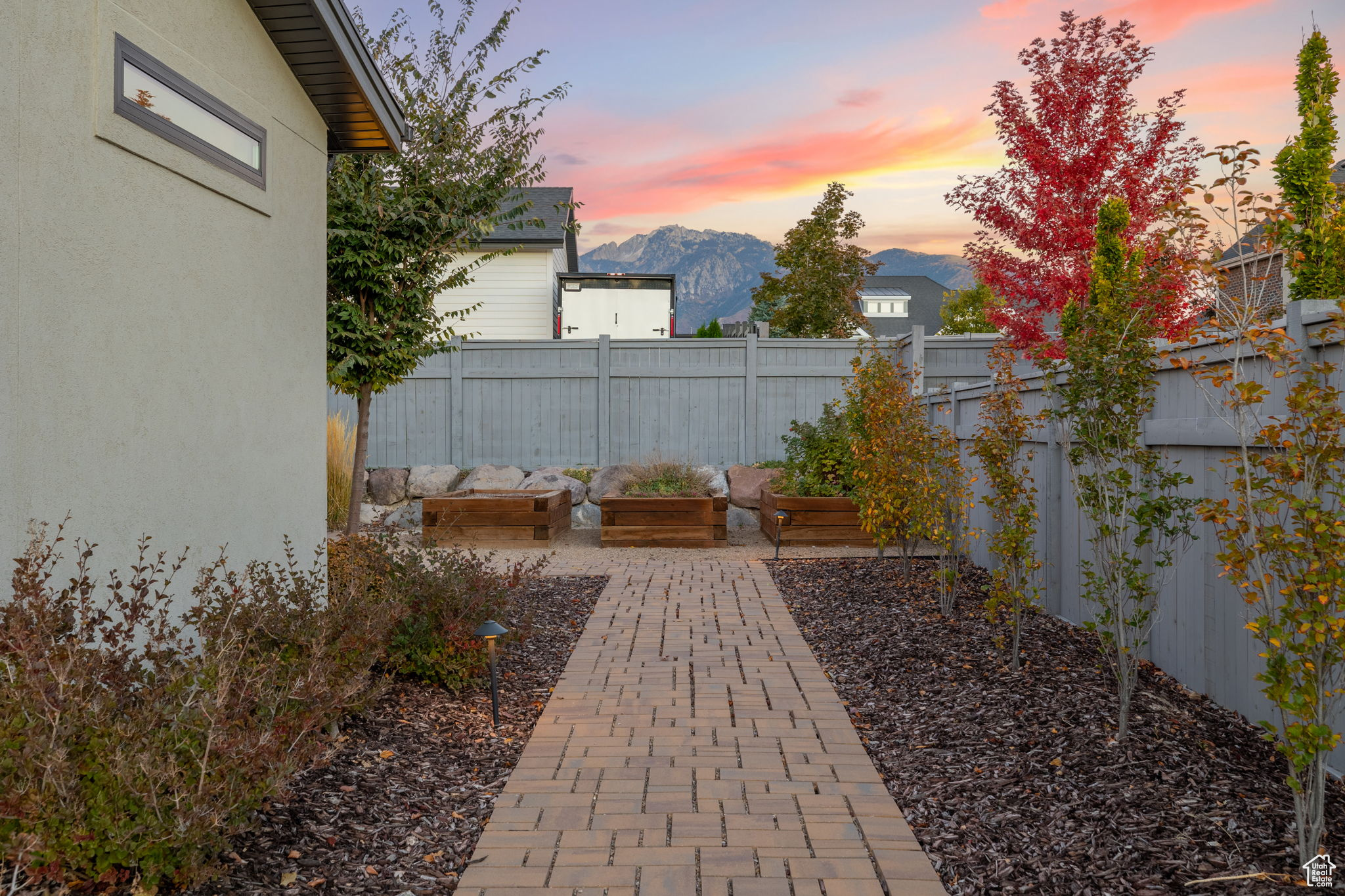 Patio terrace at dusk with a mountain view