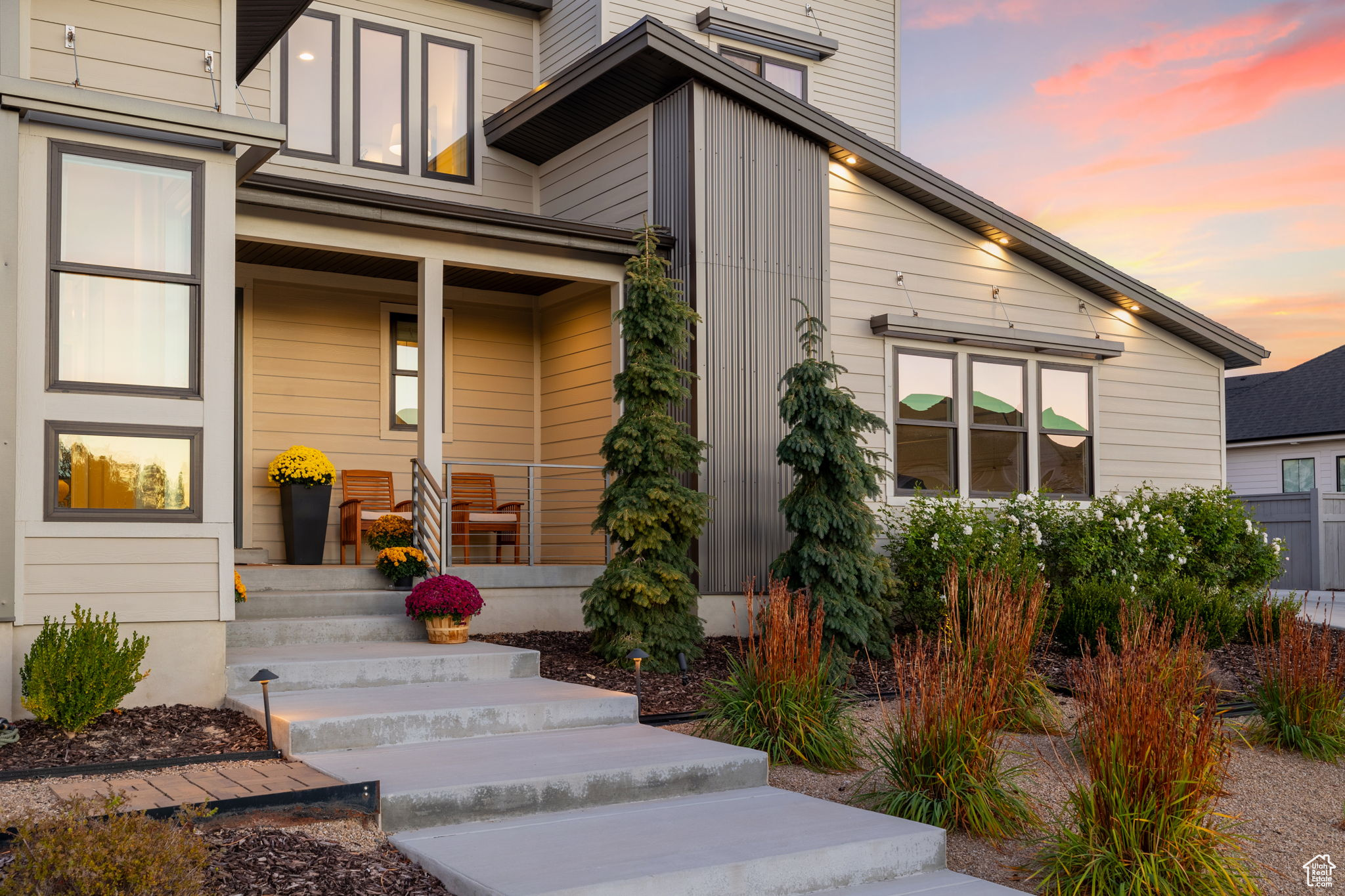 Exterior entry at dusk featuring a porch