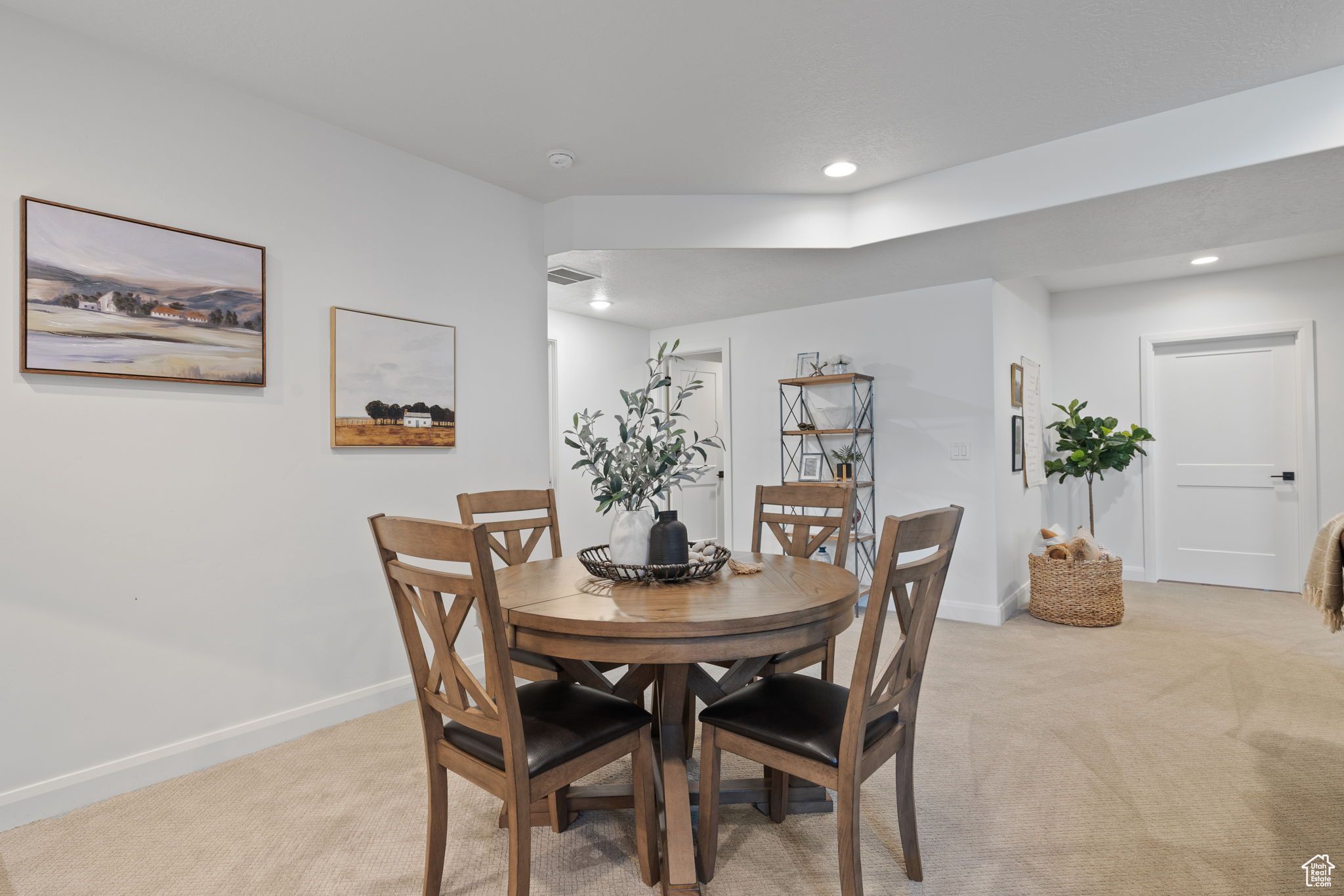 Dining space with light carpet