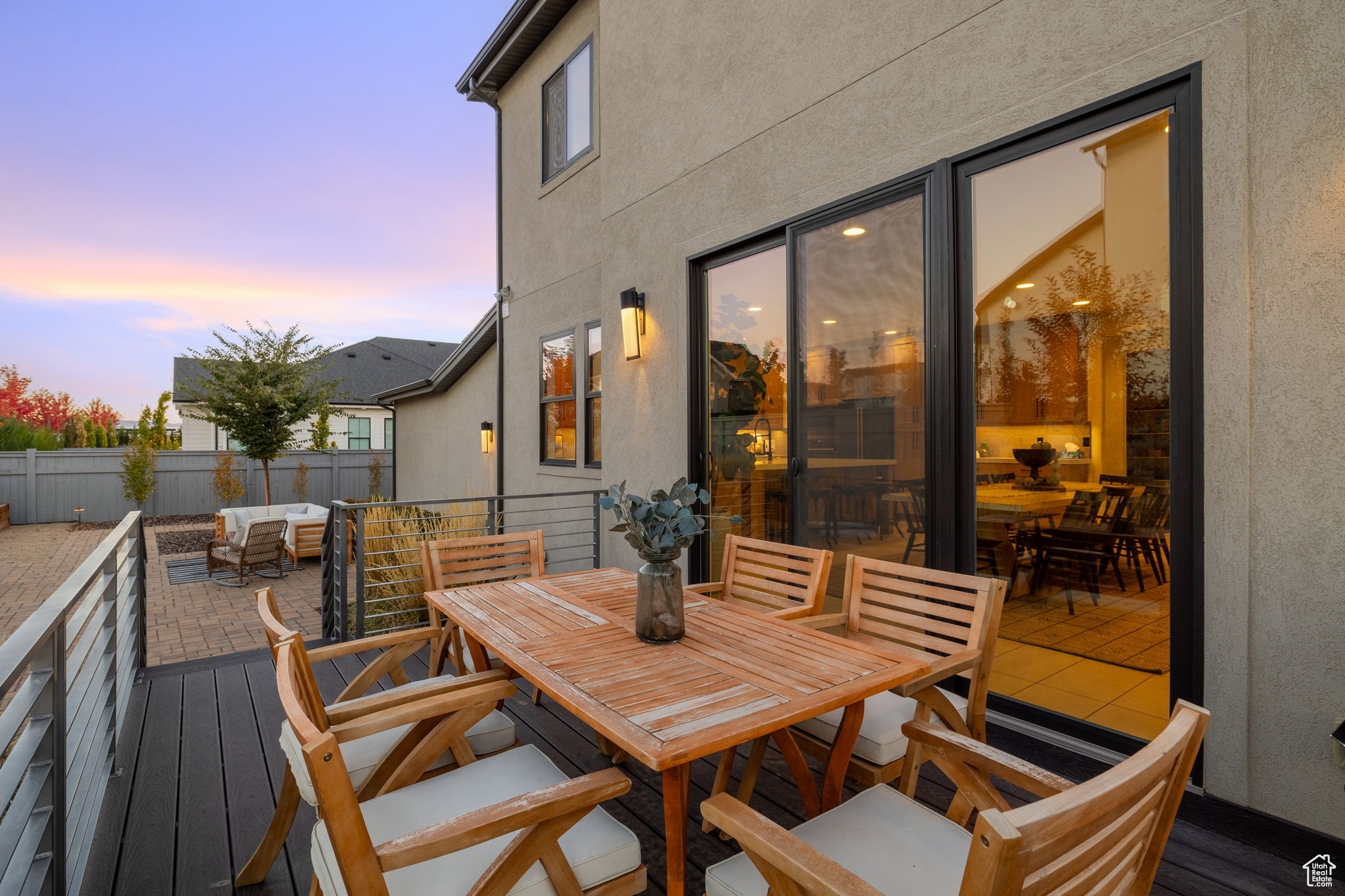 Deck at dusk with an outdoor hangout area