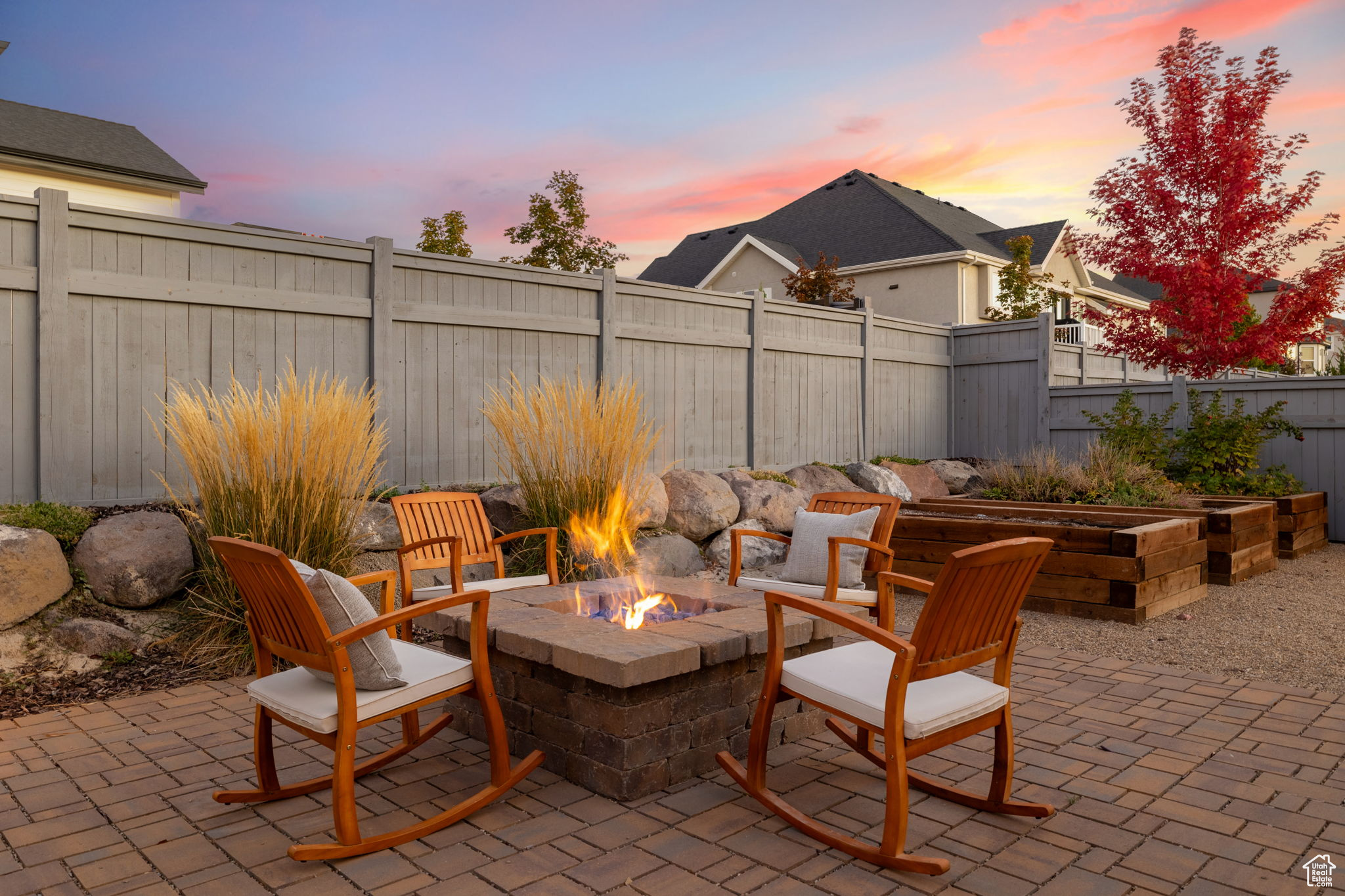 Patio terrace at dusk featuring a fire pit