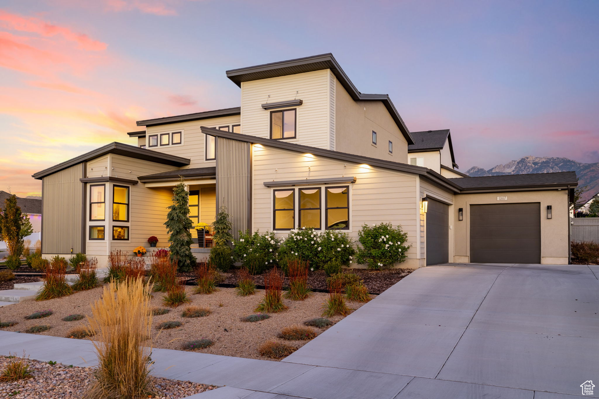 View of front of home featuring a mountain view and a garage