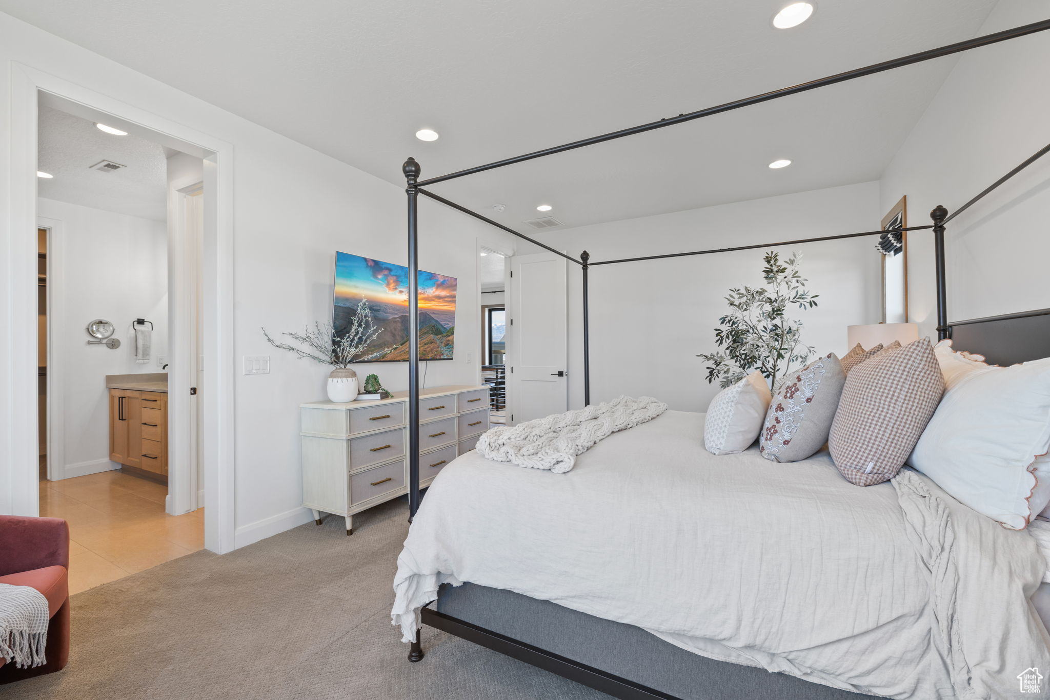 Carpeted bedroom with ensuite bathroom