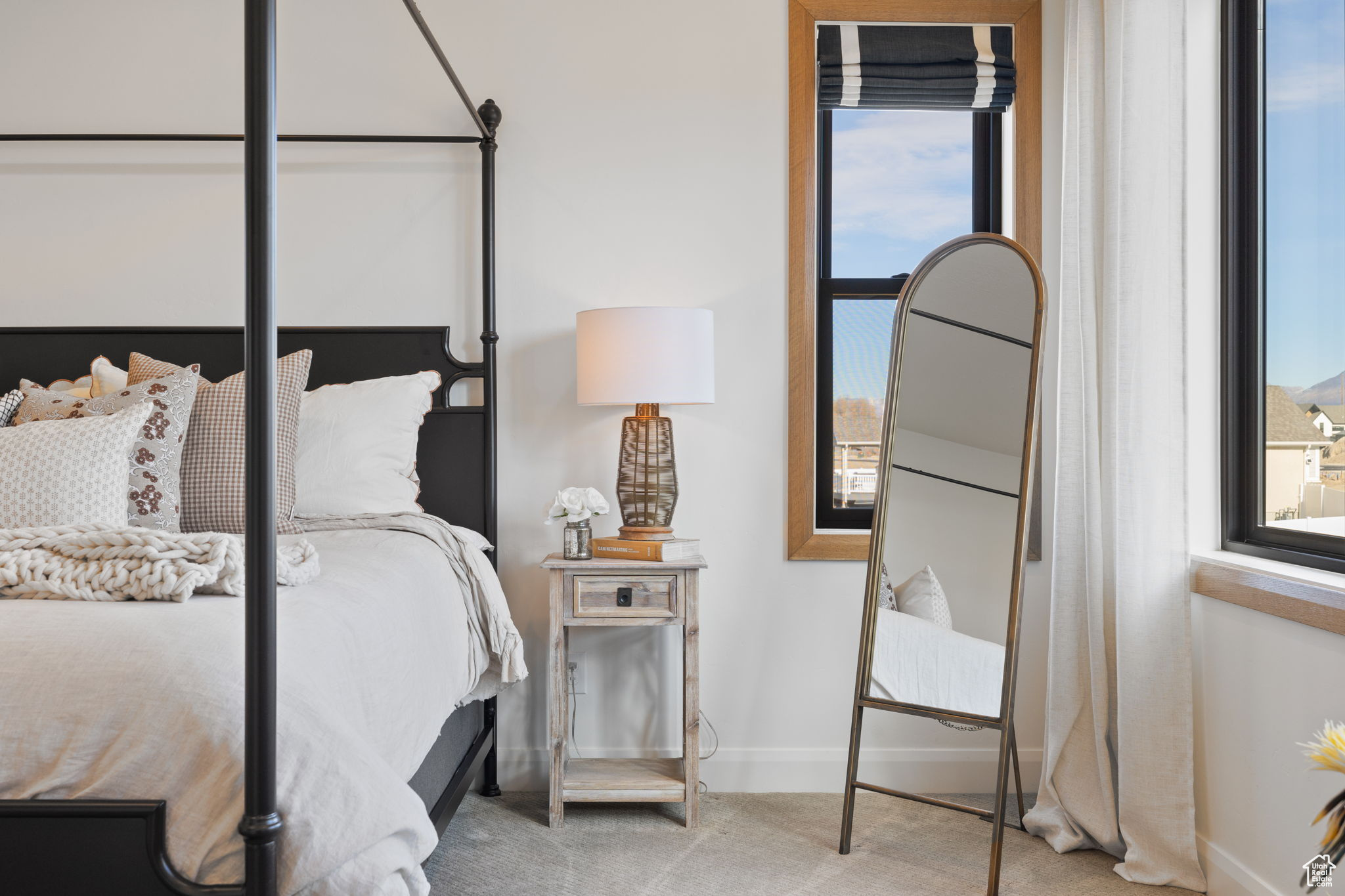 Bedroom with light colored carpet