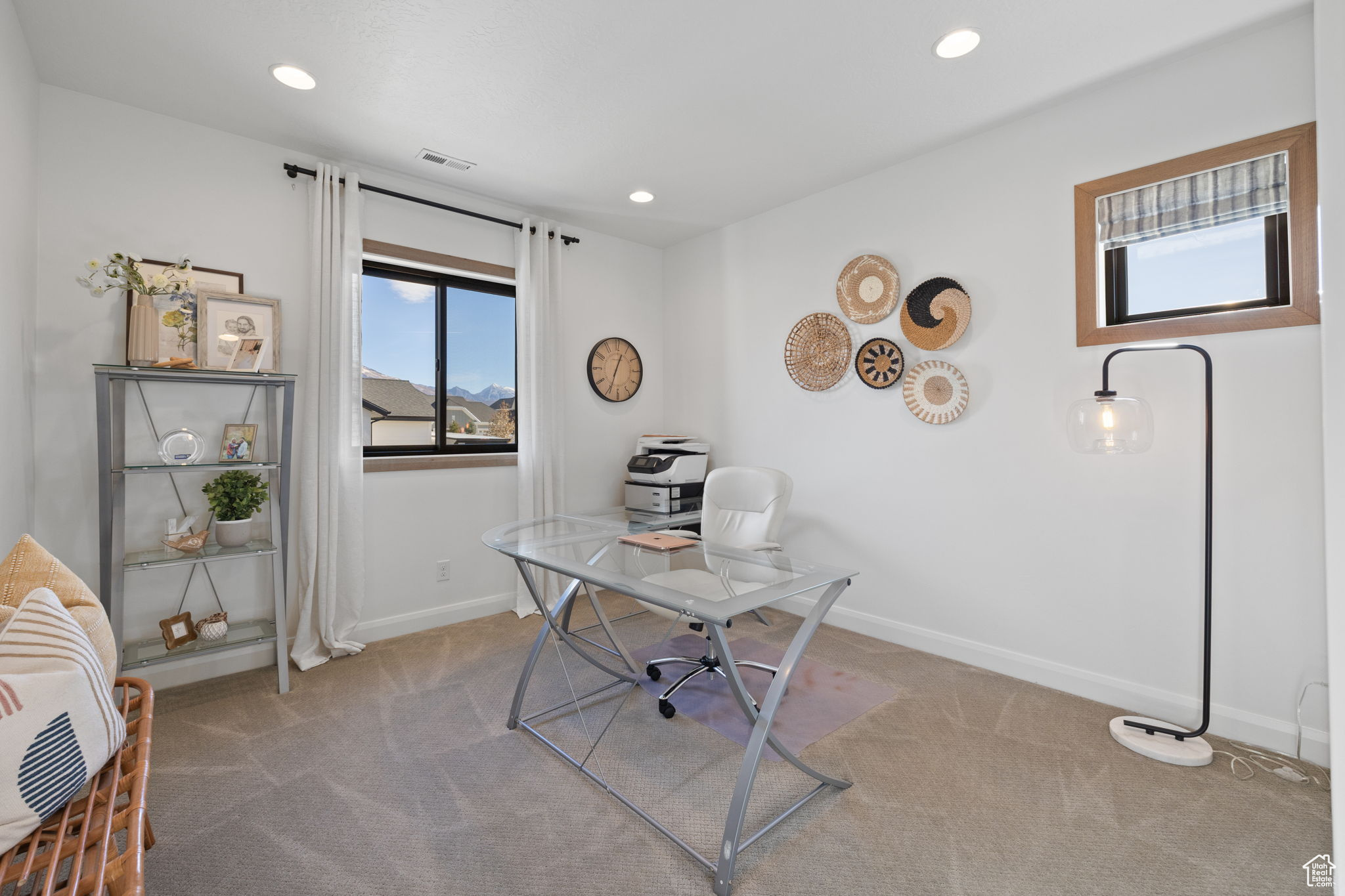 Office area featuring light carpet