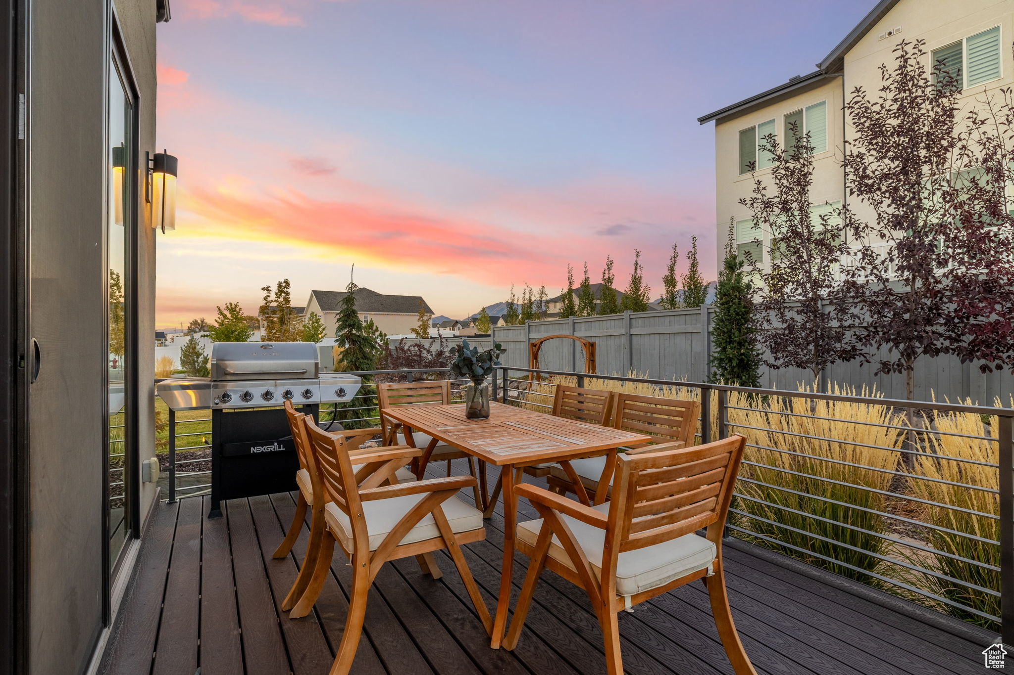 Deck at dusk featuring grilling area