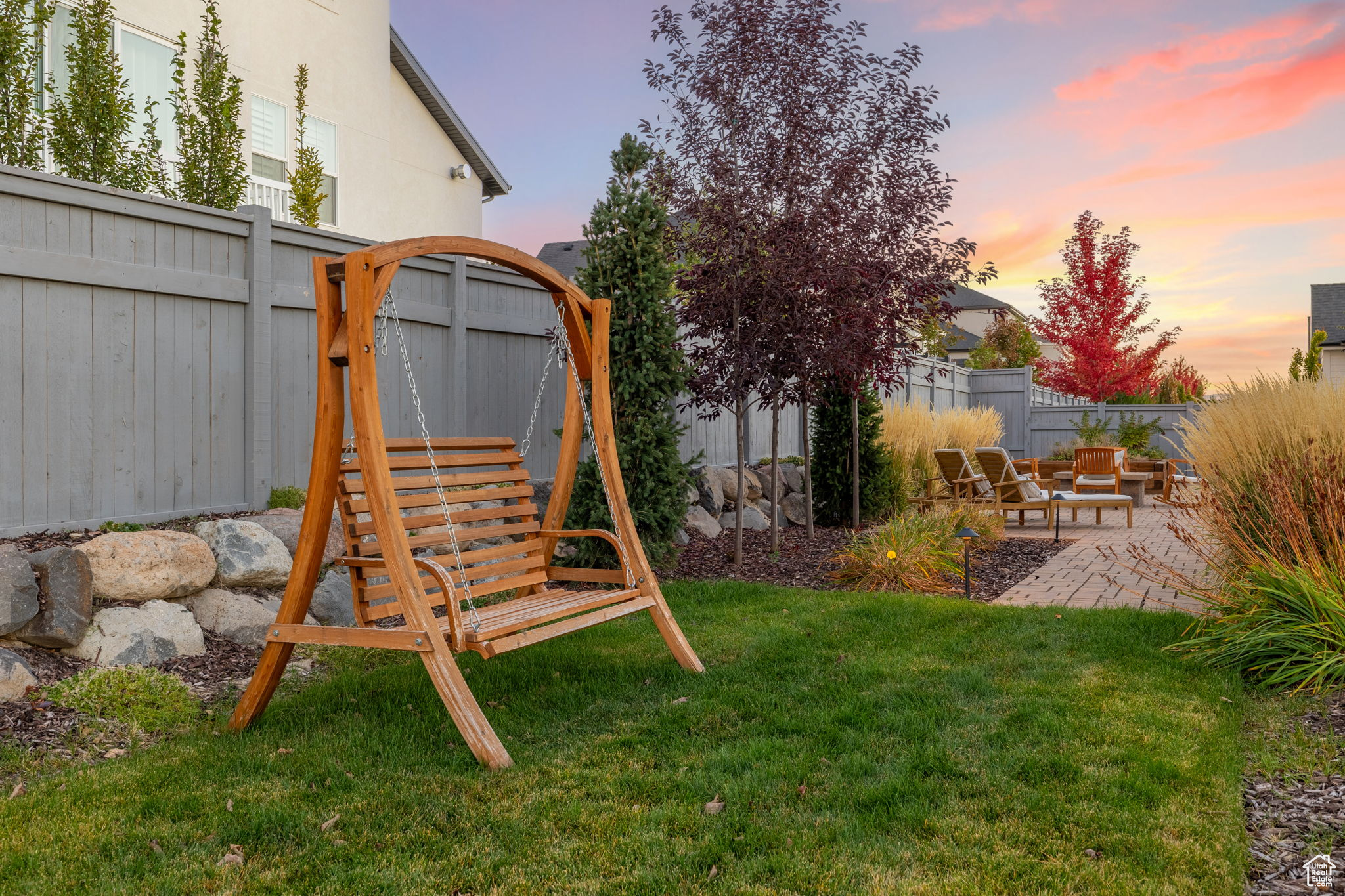 Yard at dusk with a patio area