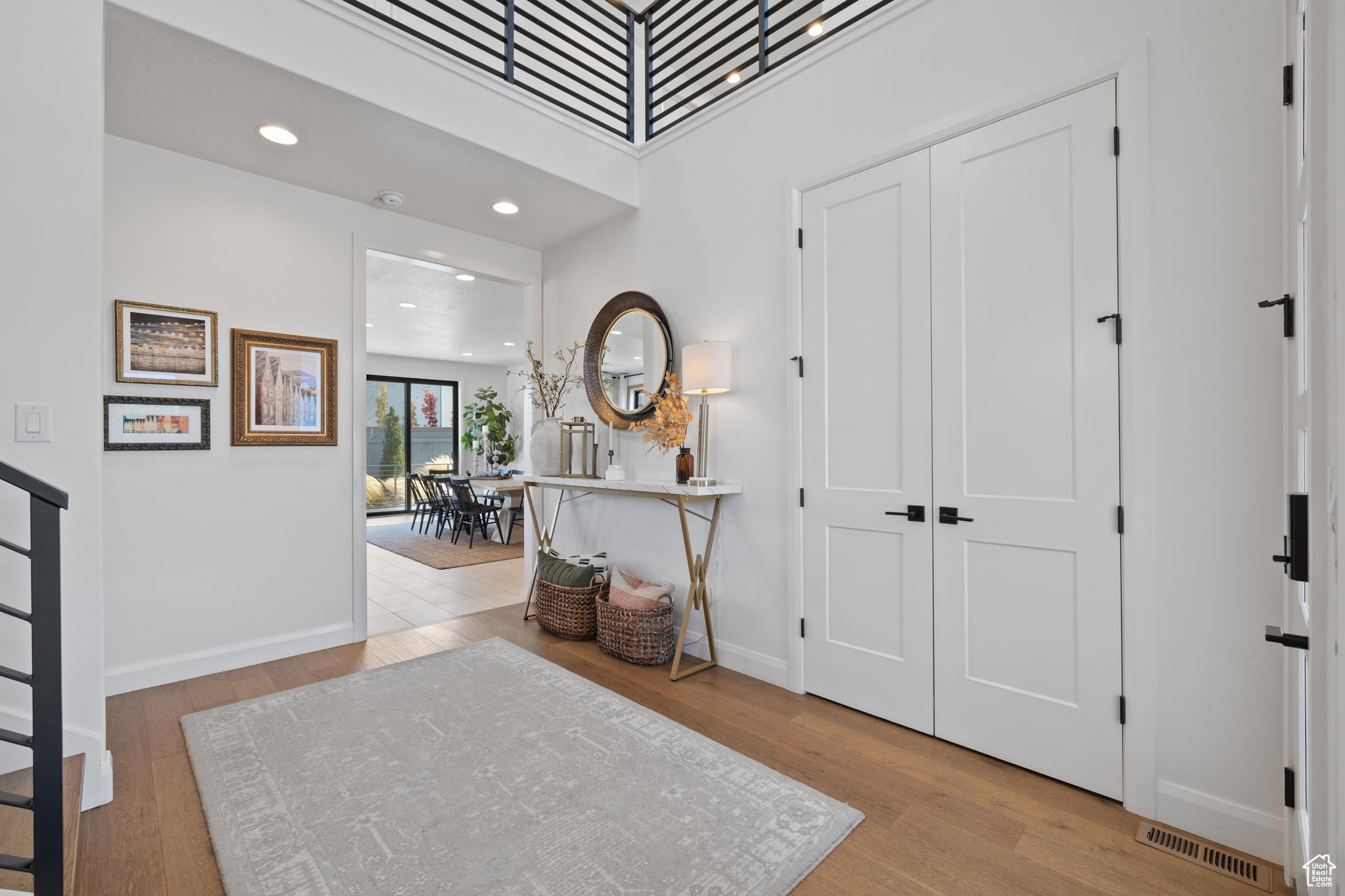 Foyer entrance with light wood-type flooring