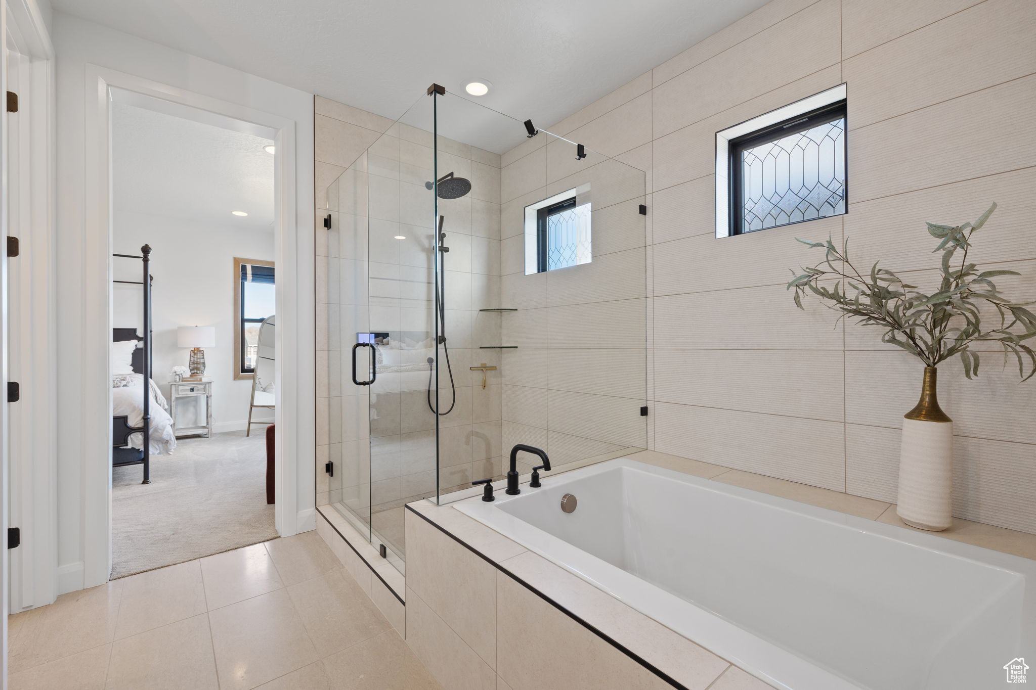 Bathroom with tile patterned flooring and plus walk in shower