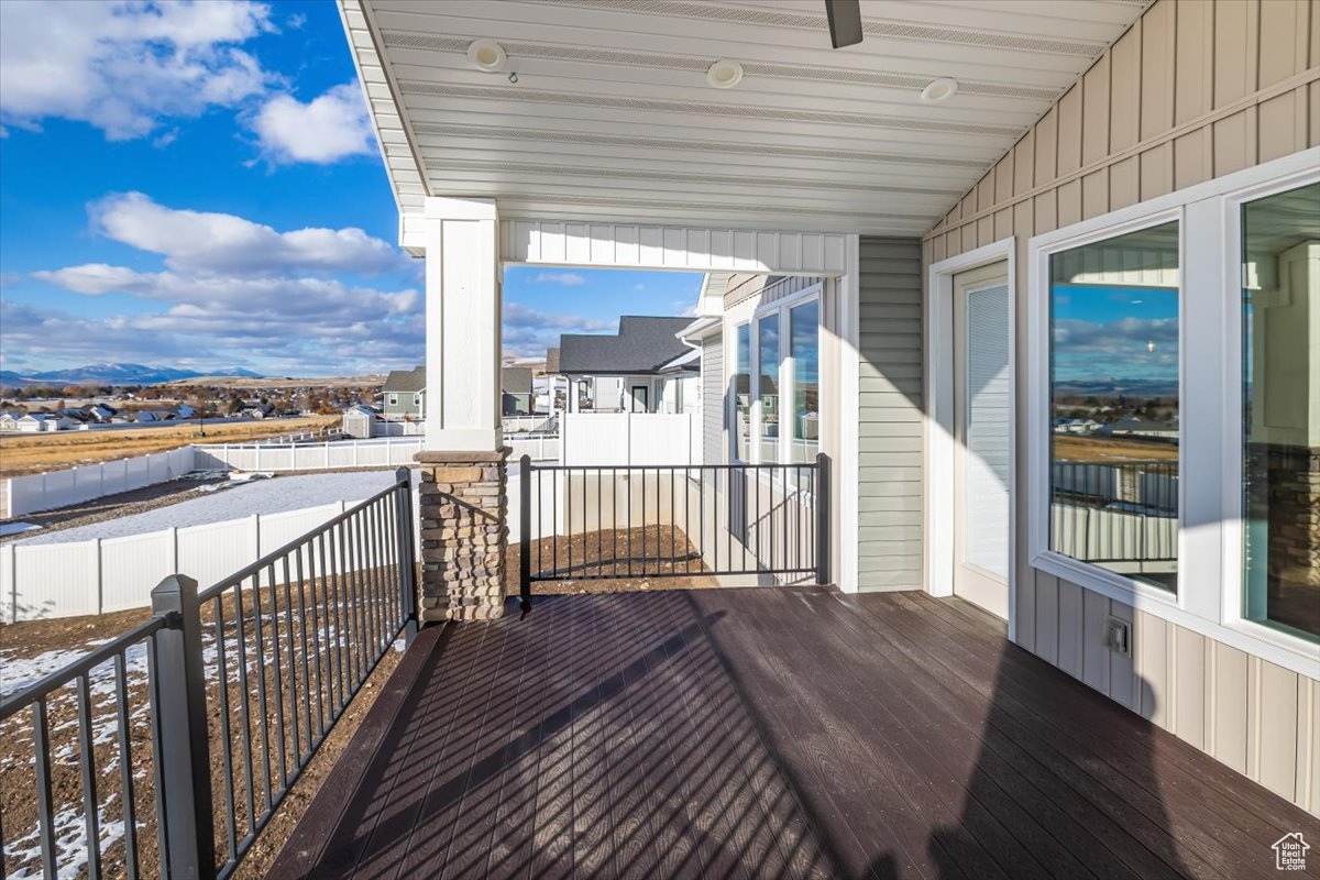 Balcony featuring ceiling fan