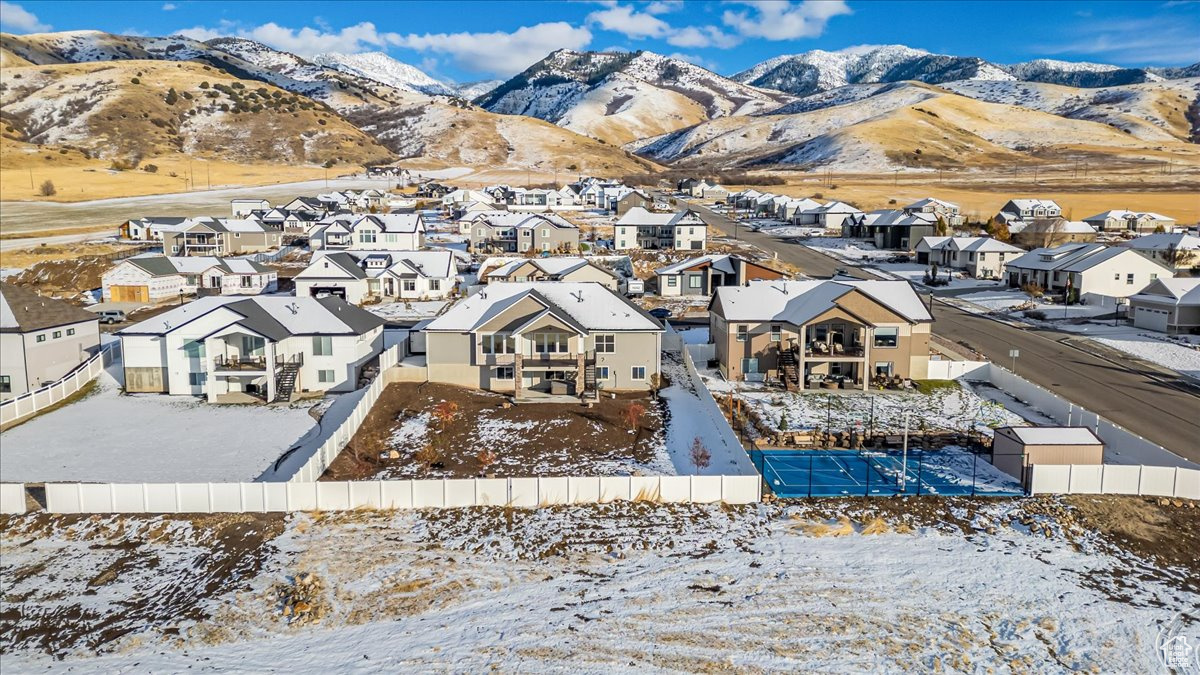 Snowy aerial view with a mountain view