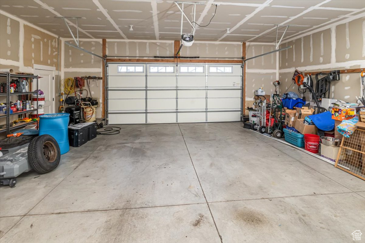 Garage featuring a garage door opener