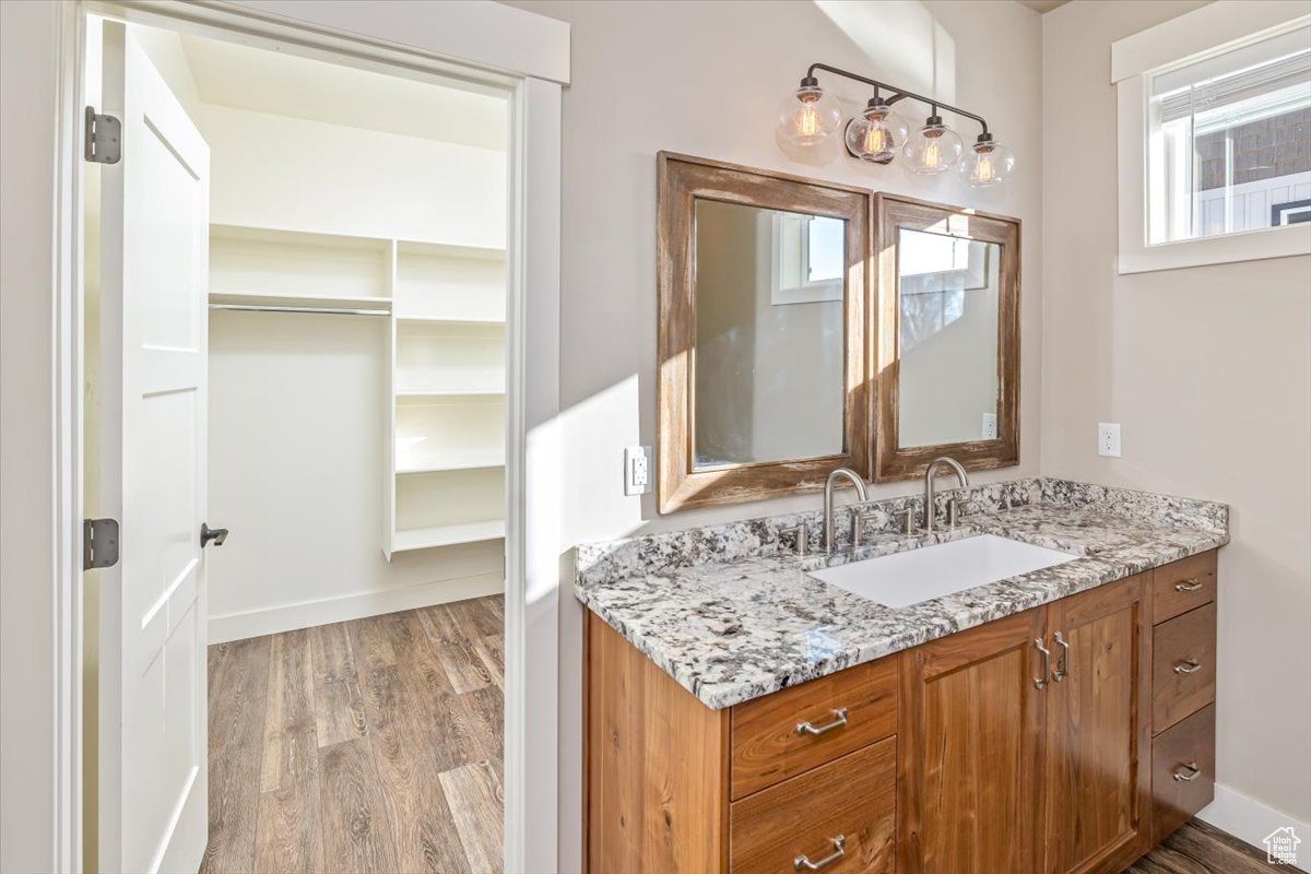 Bathroom featuring hardwood / wood-style floors and vanity