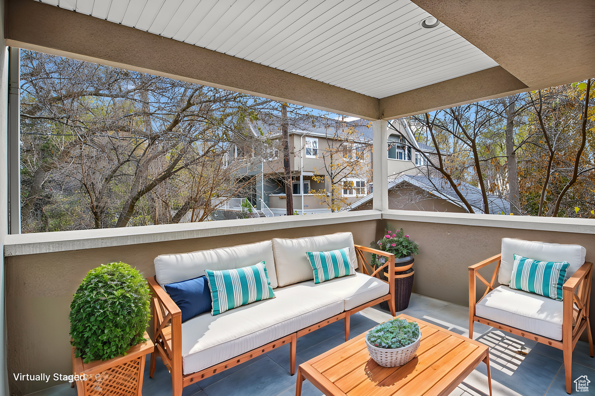 Exterior space with an outdoor hangout area and a balcony