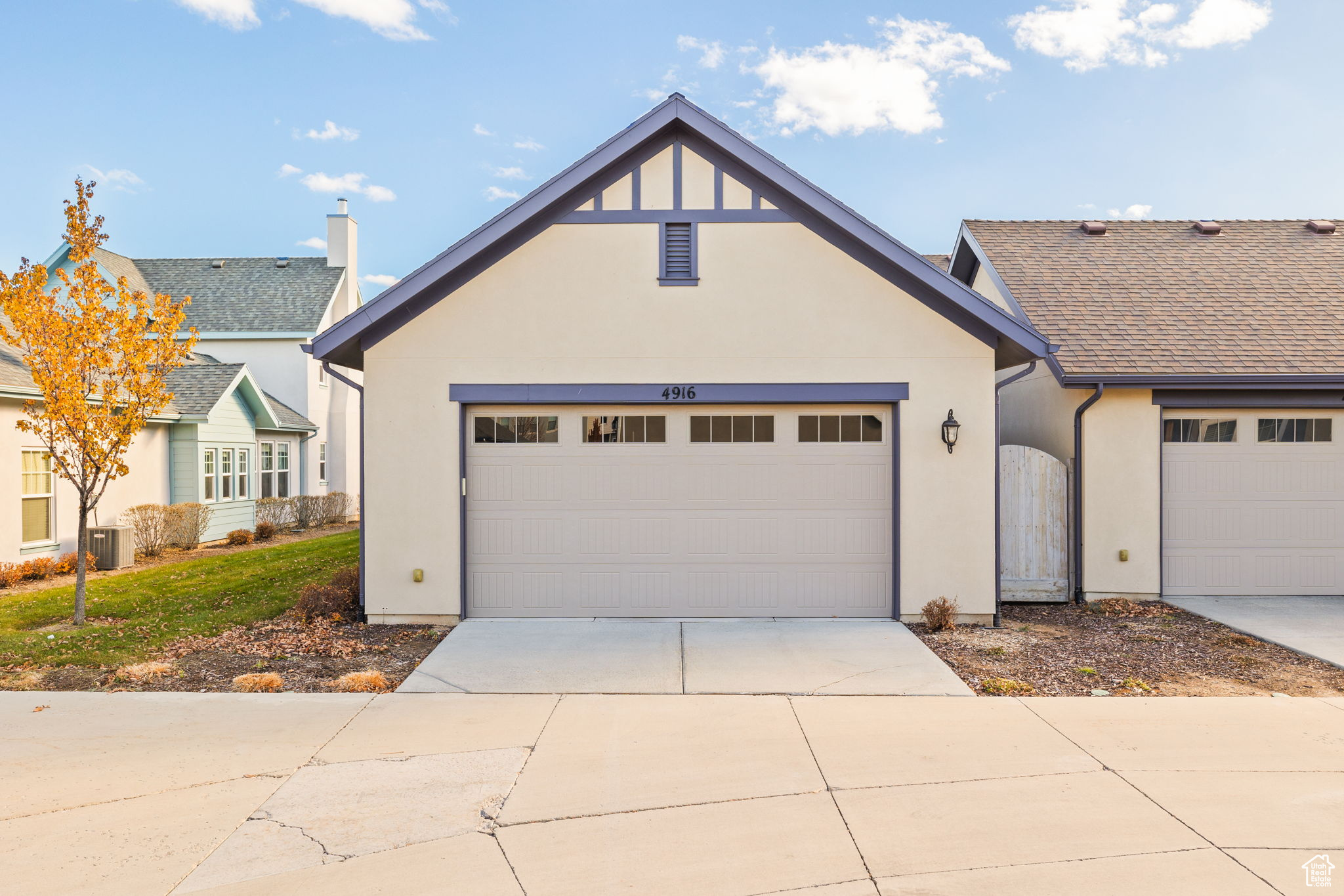 View of back of home with a garage