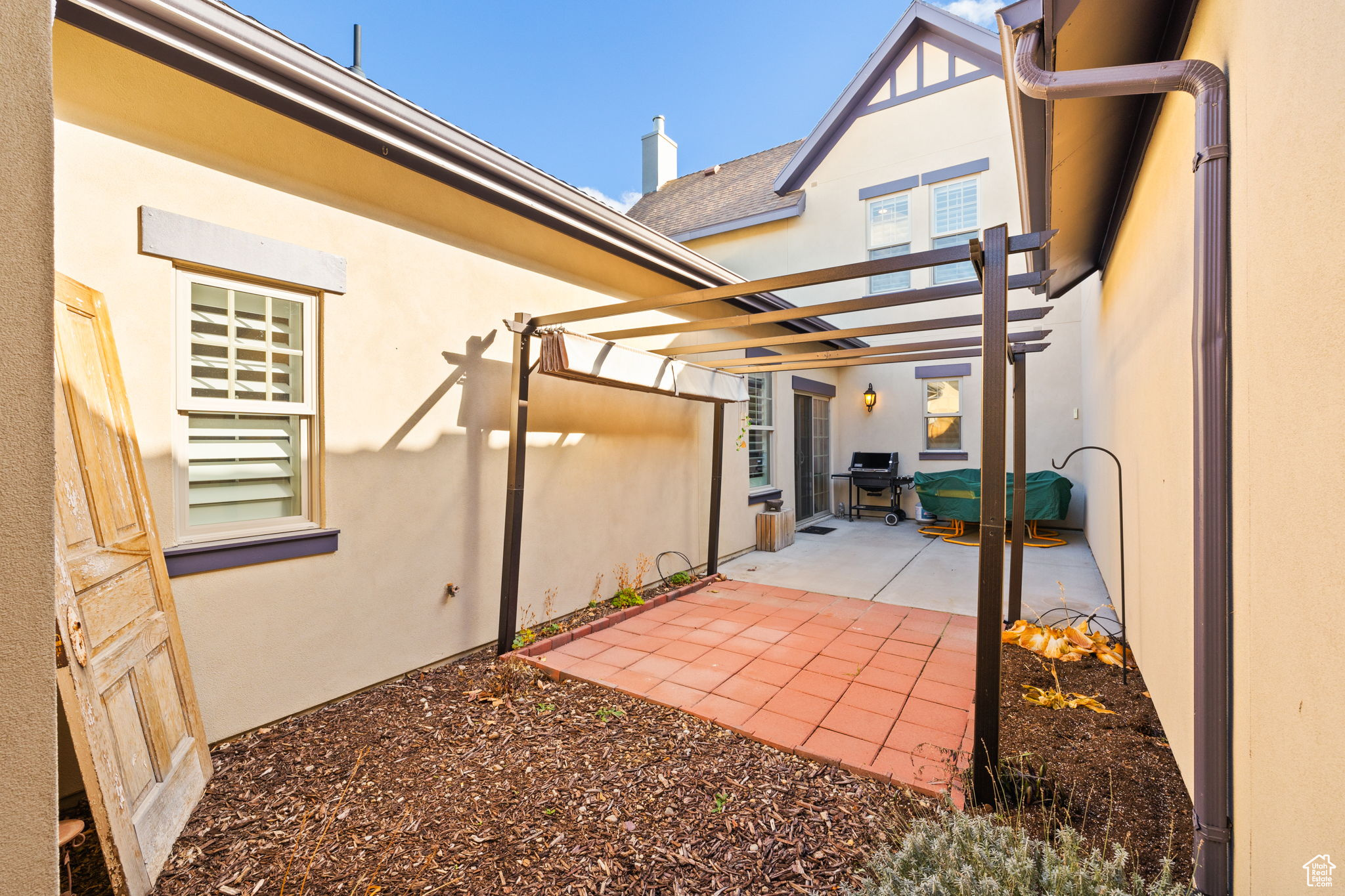 Patio featuring a pergola with  sun shade