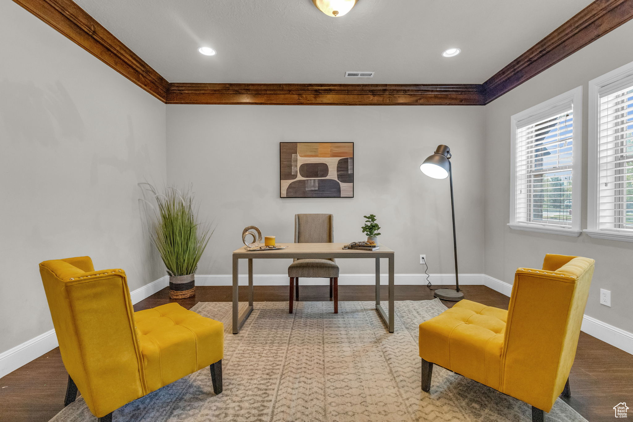 Office space featuring hardwood / wood-style floors and ornamental molding