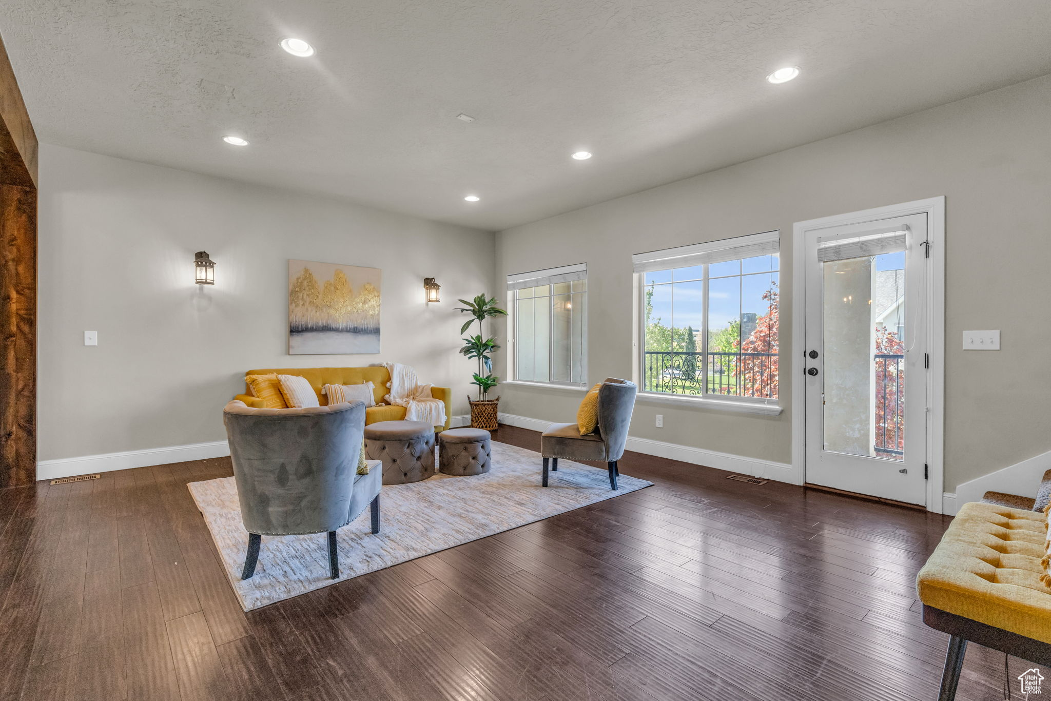 Living area featuring dark hardwood / wood-style flooring and a textured ceiling