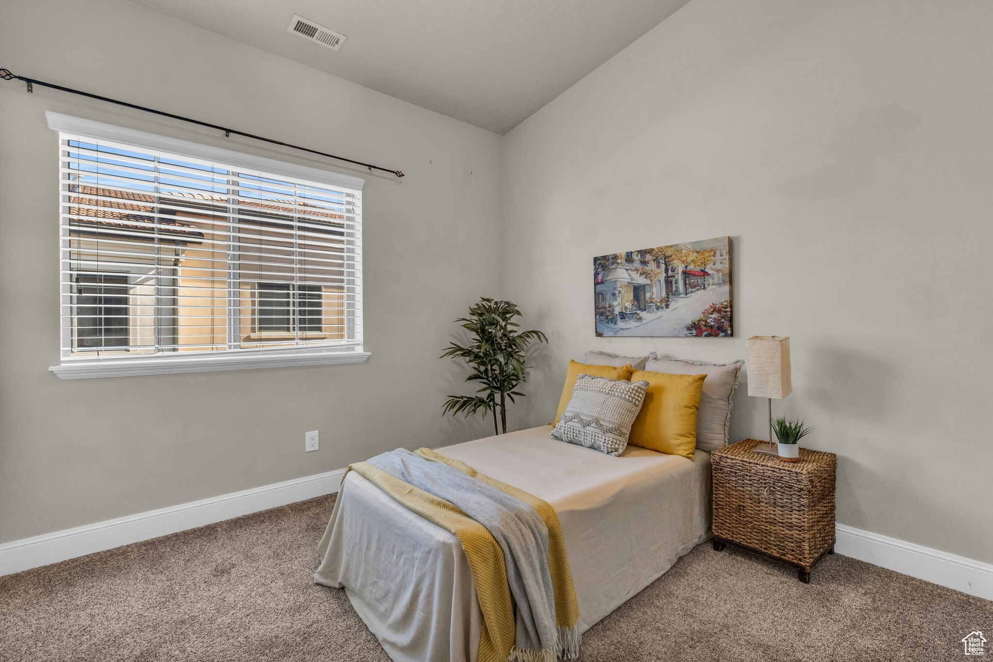 Carpeted bedroom with lofted ceiling