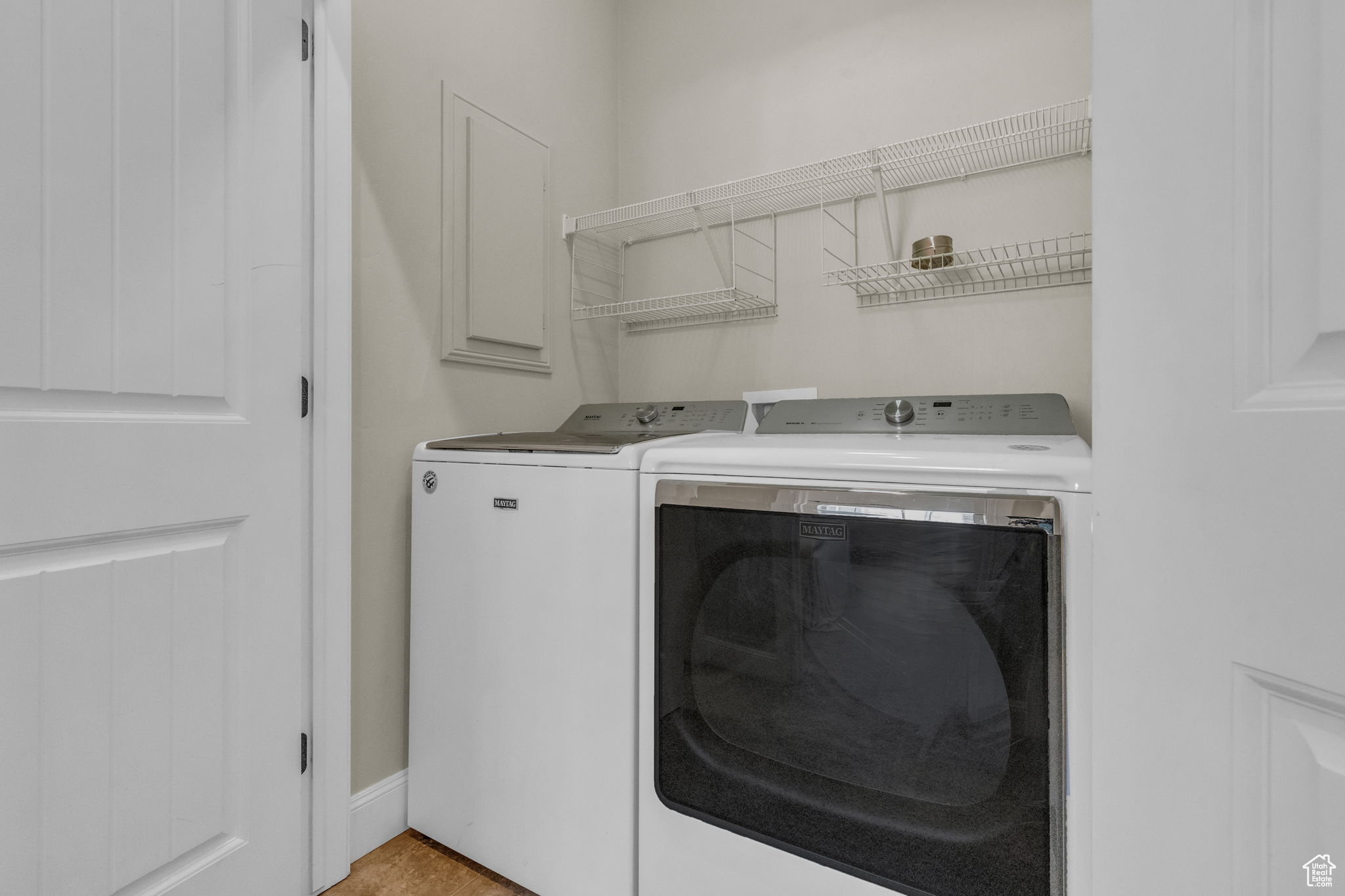 Laundry room featuring washer and clothes dryer