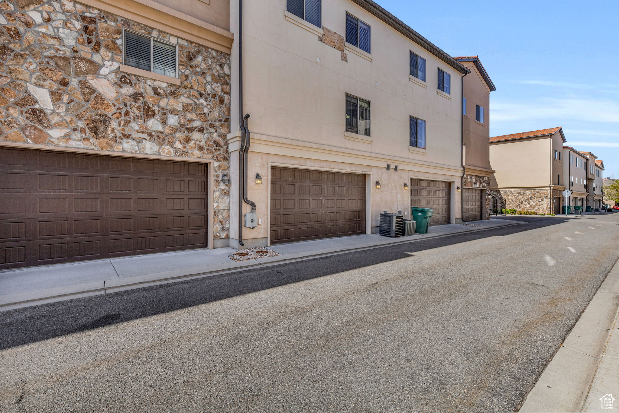 Exterior space featuring a garage and central air condition unit