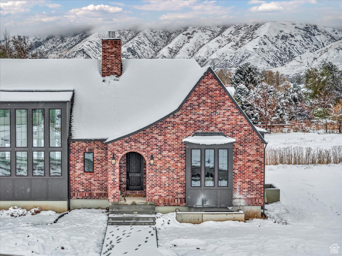 Exterior space with a mountain view and french doors